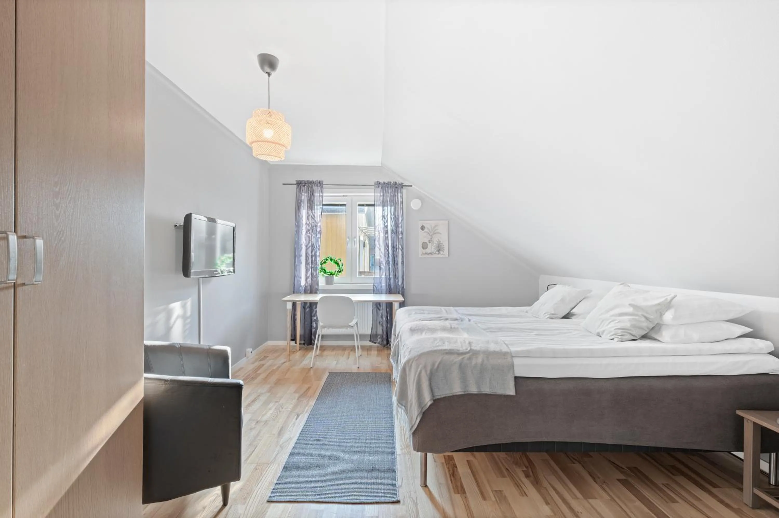 Bed in Uppsala Lägenhetshotell