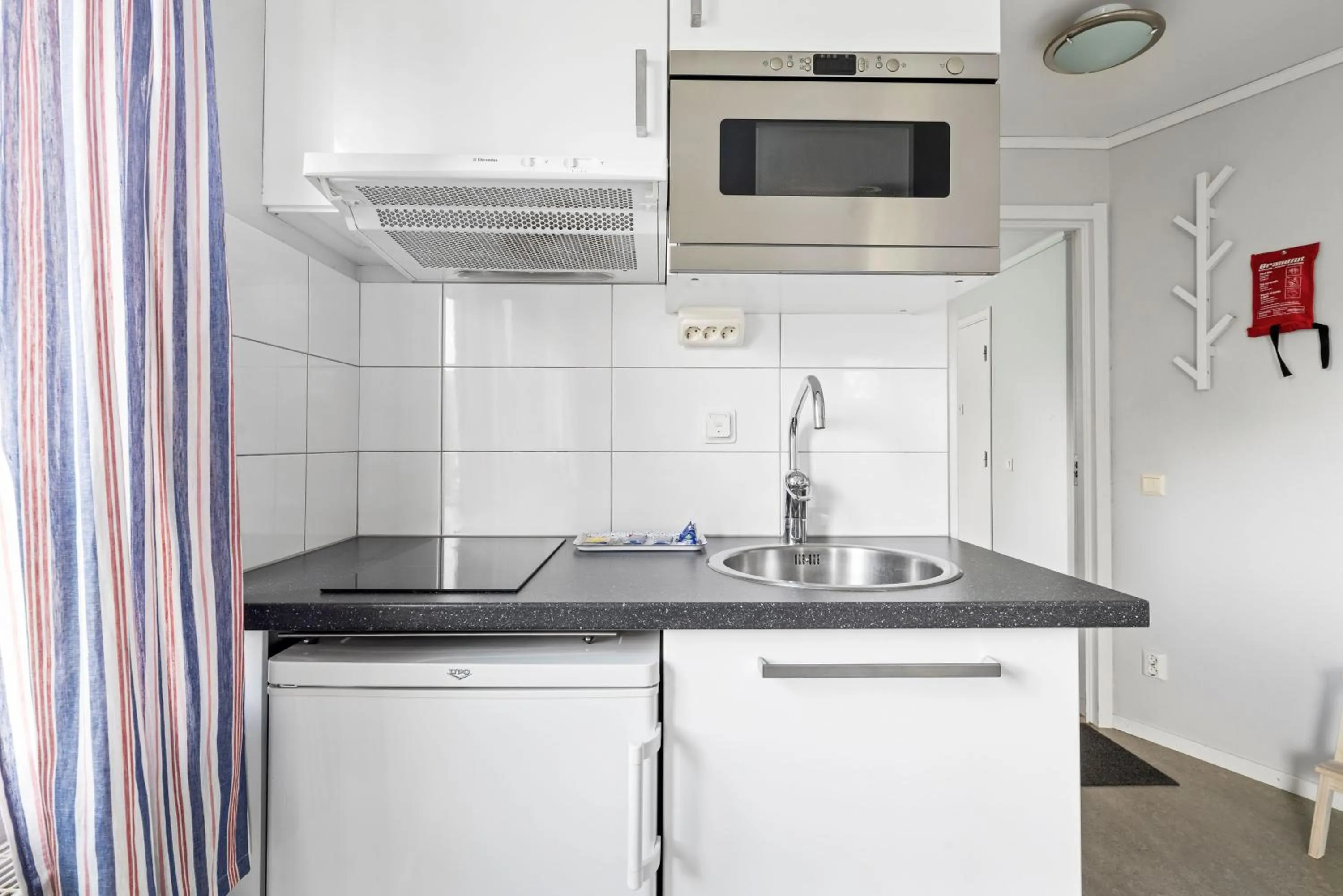 Kitchen or kitchenette in Uppsala Lägenhetshotell