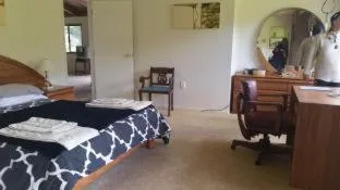 Bed in Waiotemarama Falls Lodge