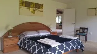 Bed in Waiotemarama Falls Lodge