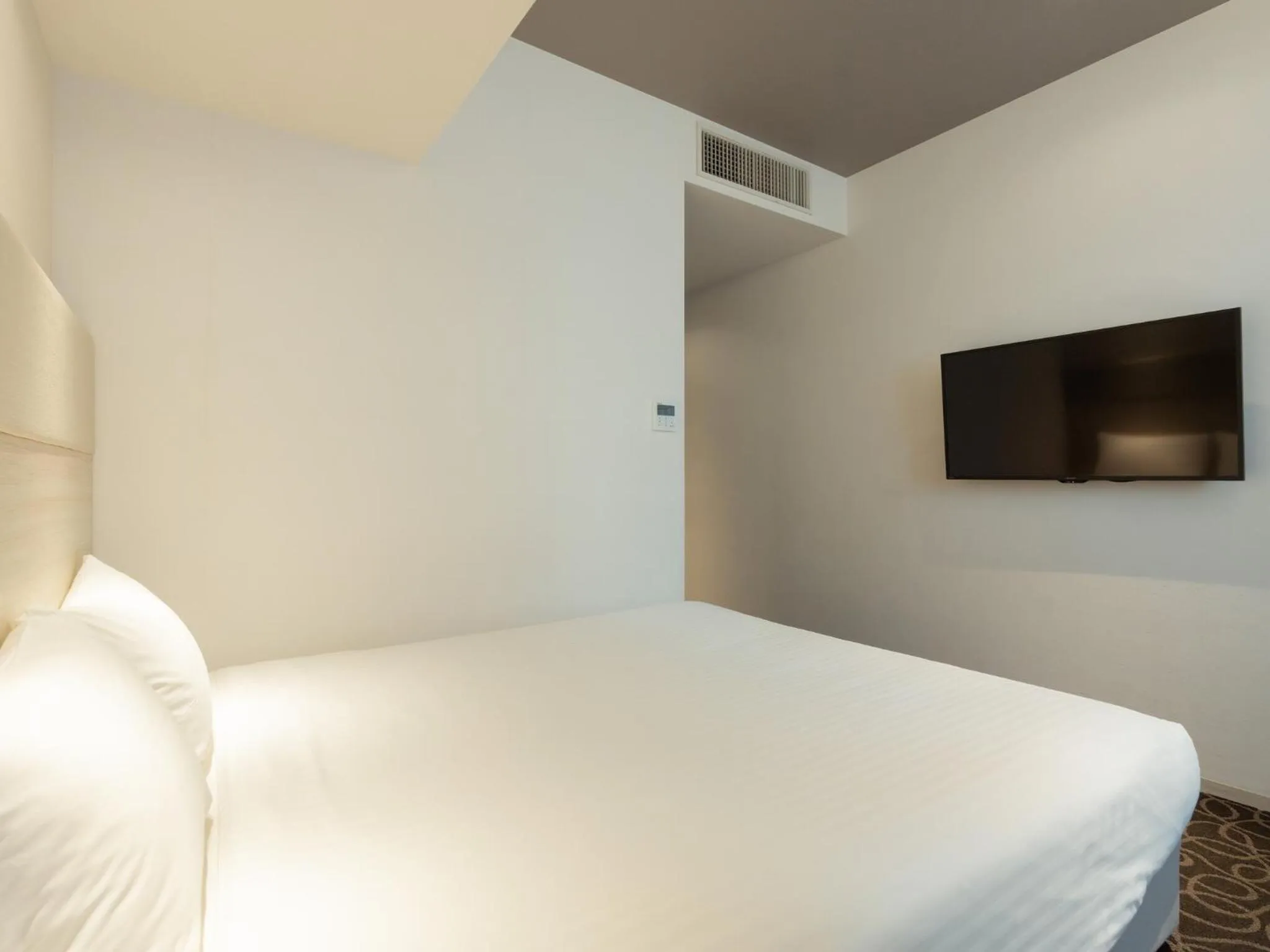 Bed in Hotel Aqua Citta Naha