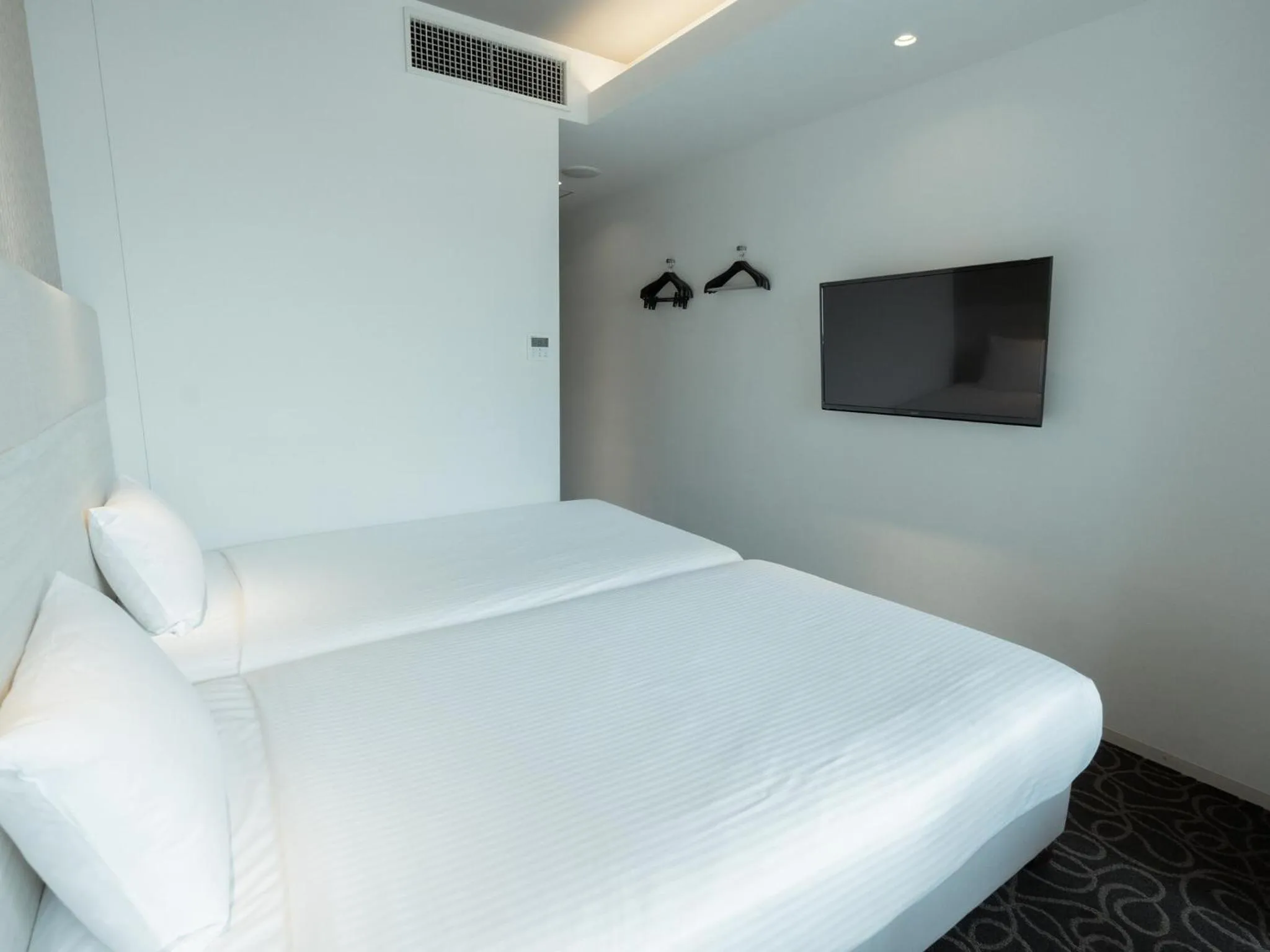 Bed in Hotel Aqua Citta Naha