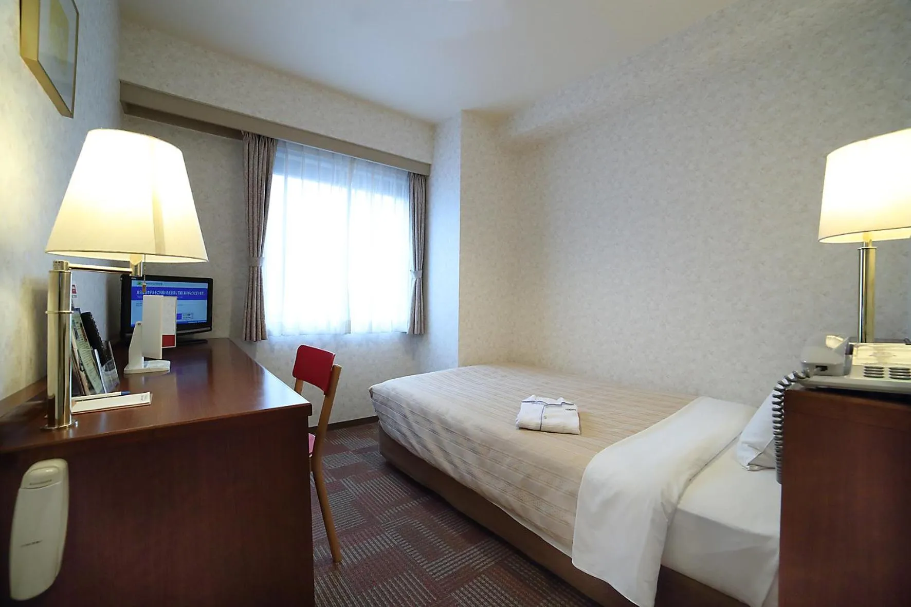 Bed in Kumegawa Wing Hotel