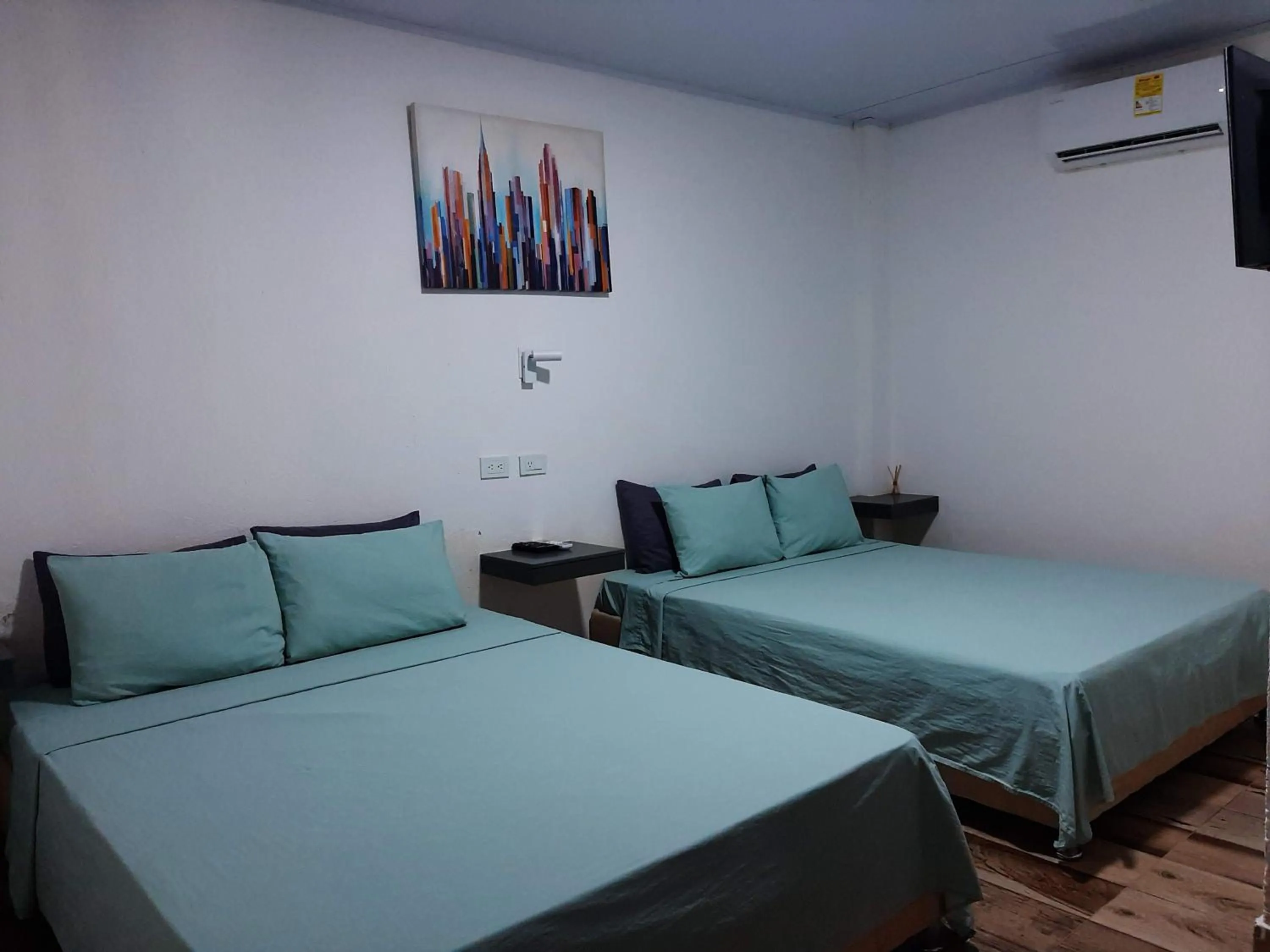 Bed in Hotel Sunset Beach