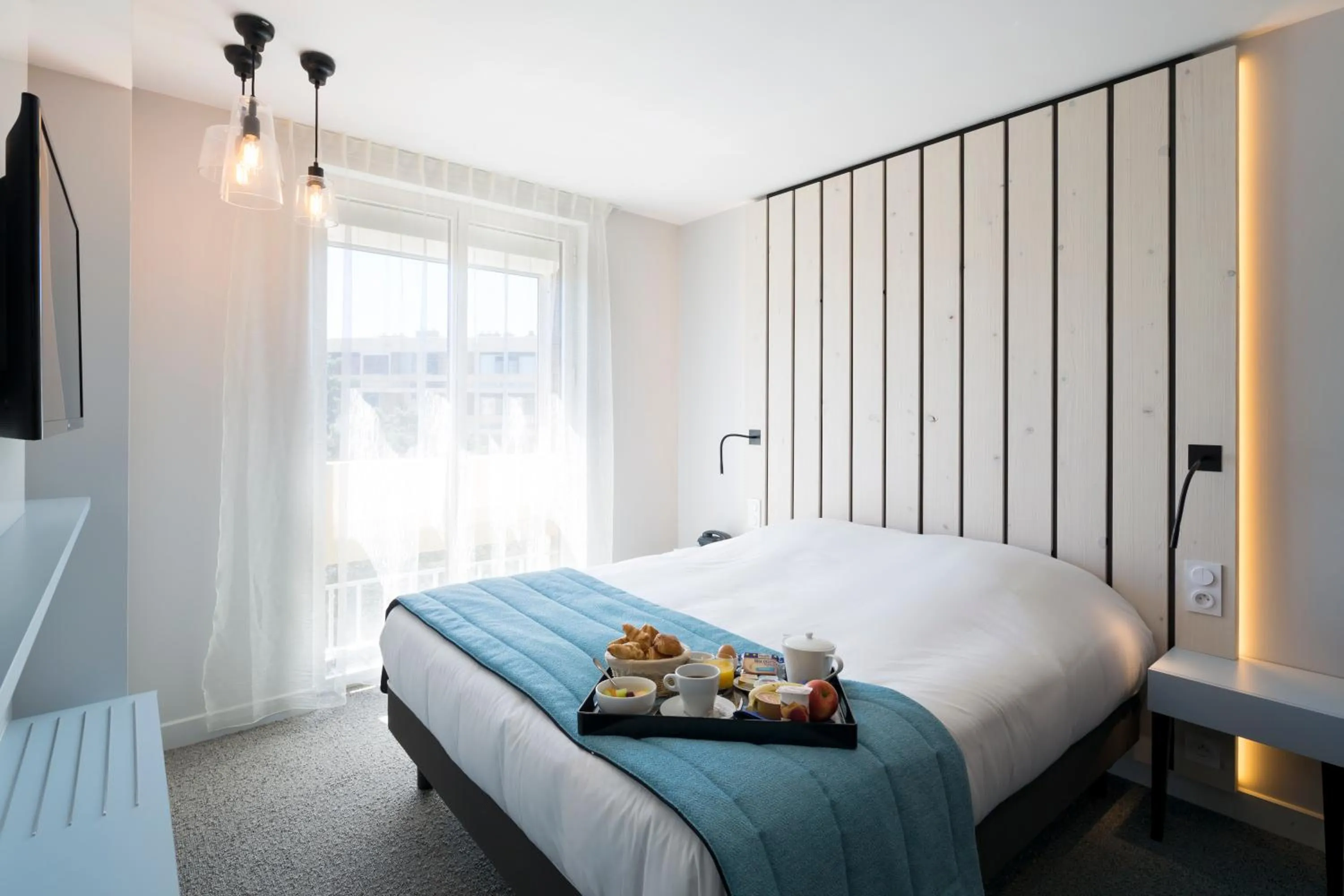 Photo of the whole room, Bed in Logis Hôtel Les Pins - Opéralia