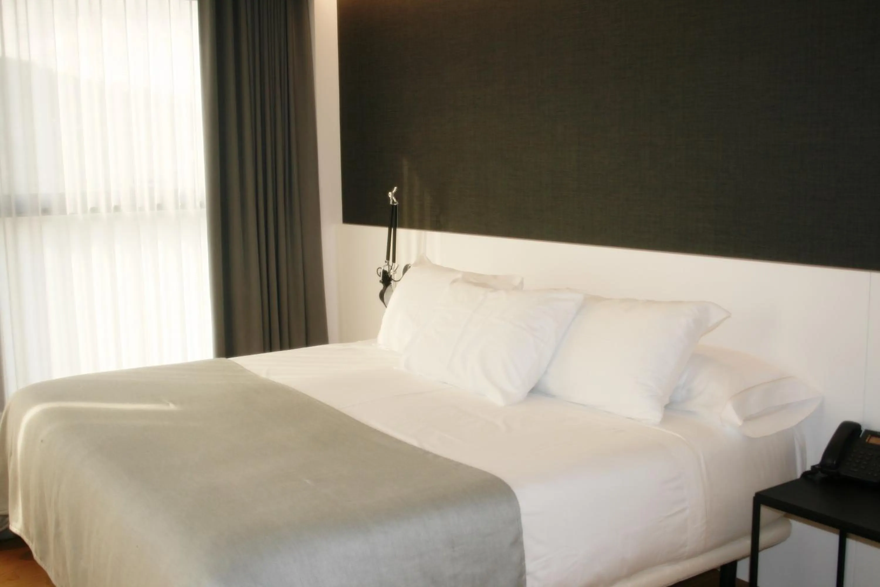 Bed in Hotel U Viveiro