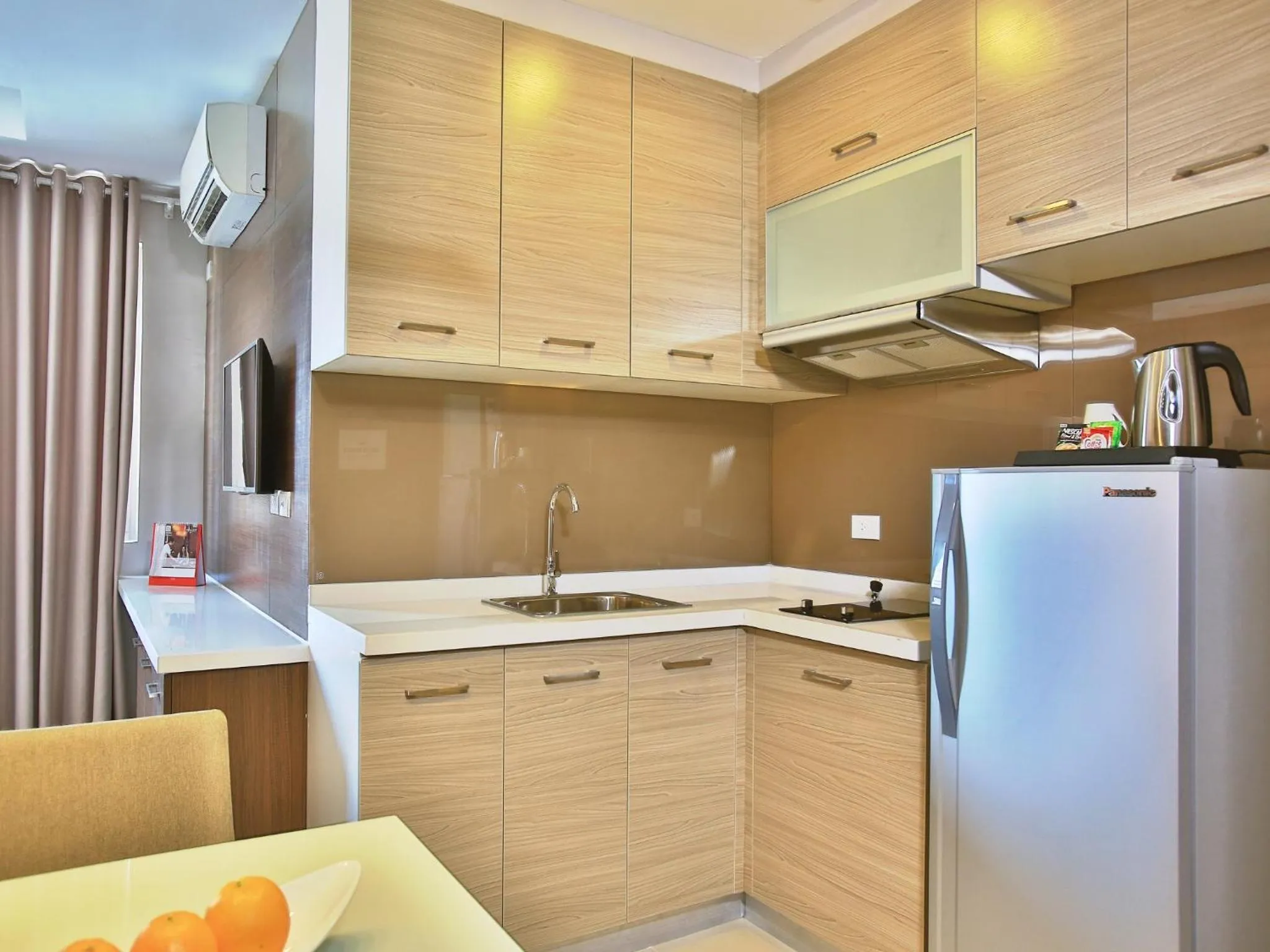 Kitchen or kitchenette in Valero Grand Suites by Swiss-Belhotel