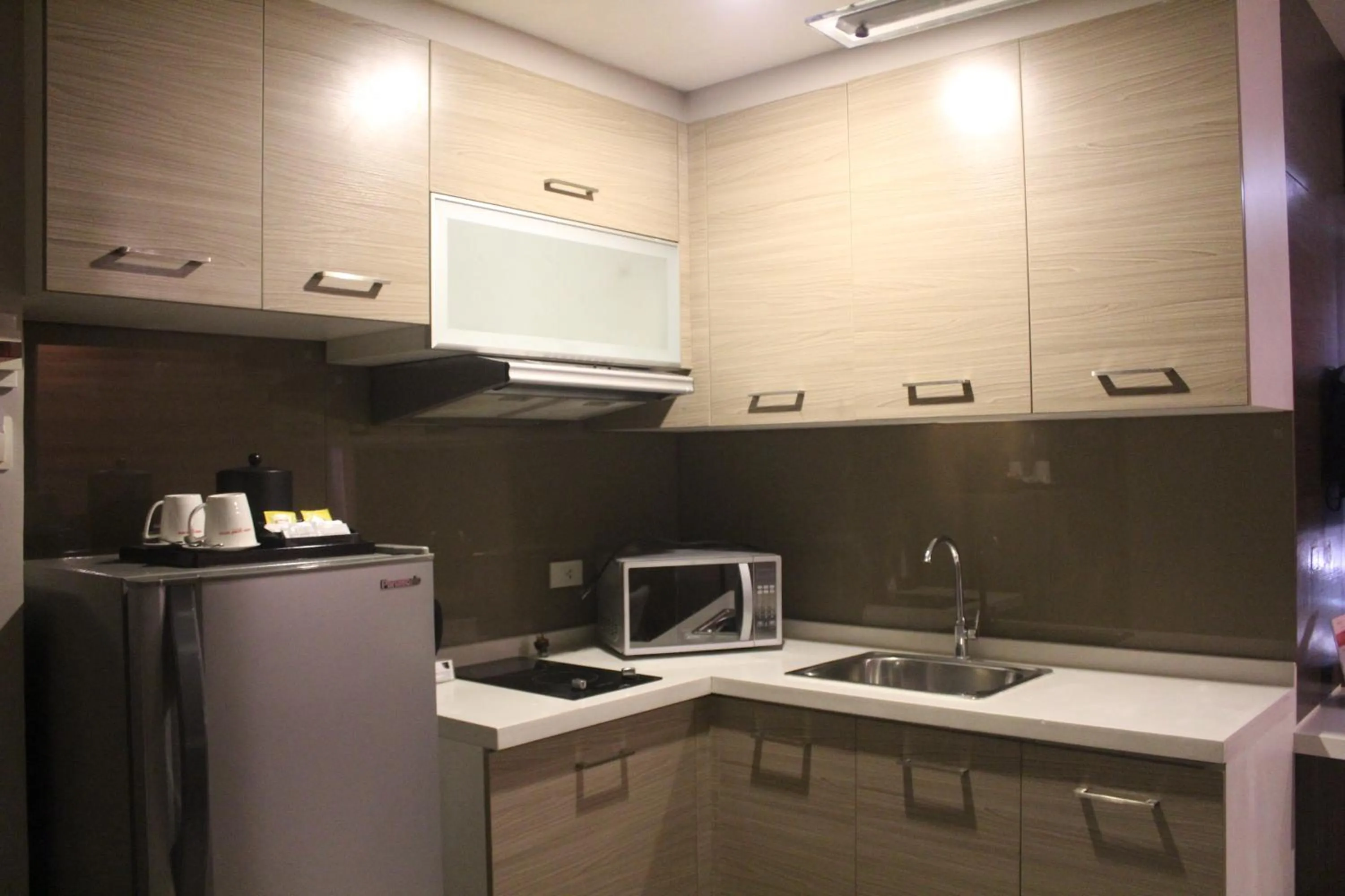 Kitchen or kitchenette in Valero Grand Suites by Swiss-Belhotel