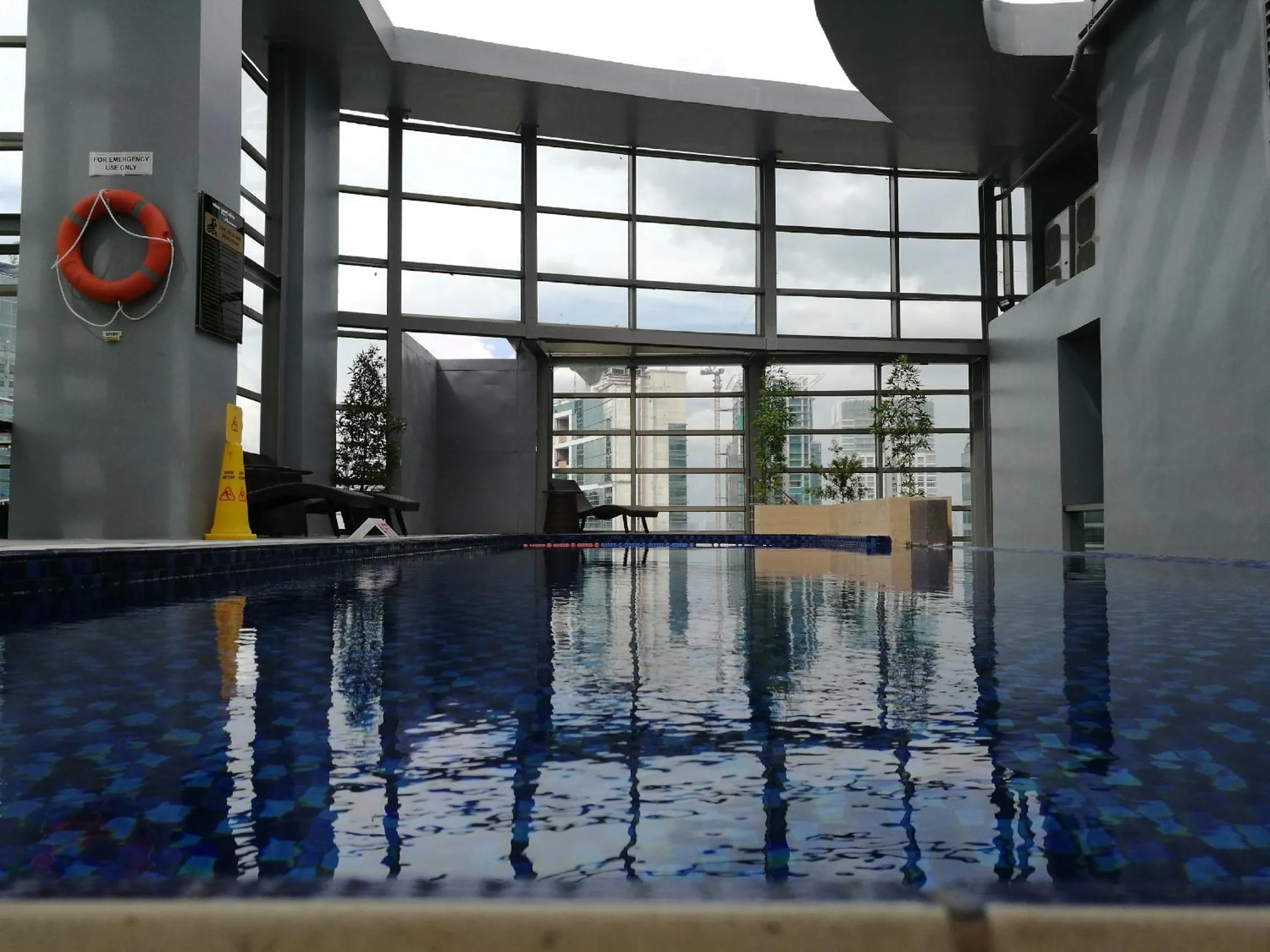 Swimming pool in Valero Grand Suites by Swiss-Belhotel