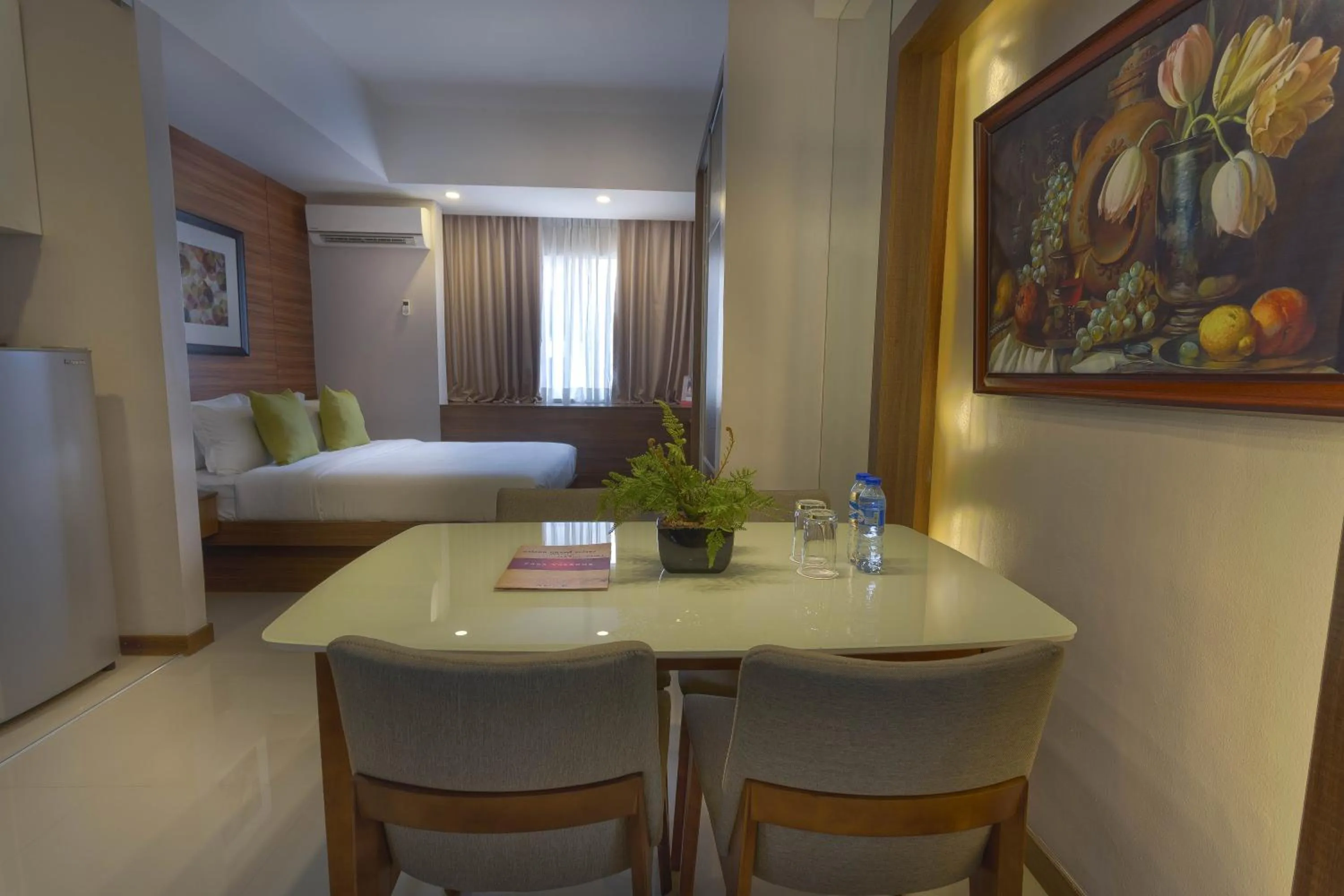 Bed in Valero Grand Suites by Swiss-Belhotel