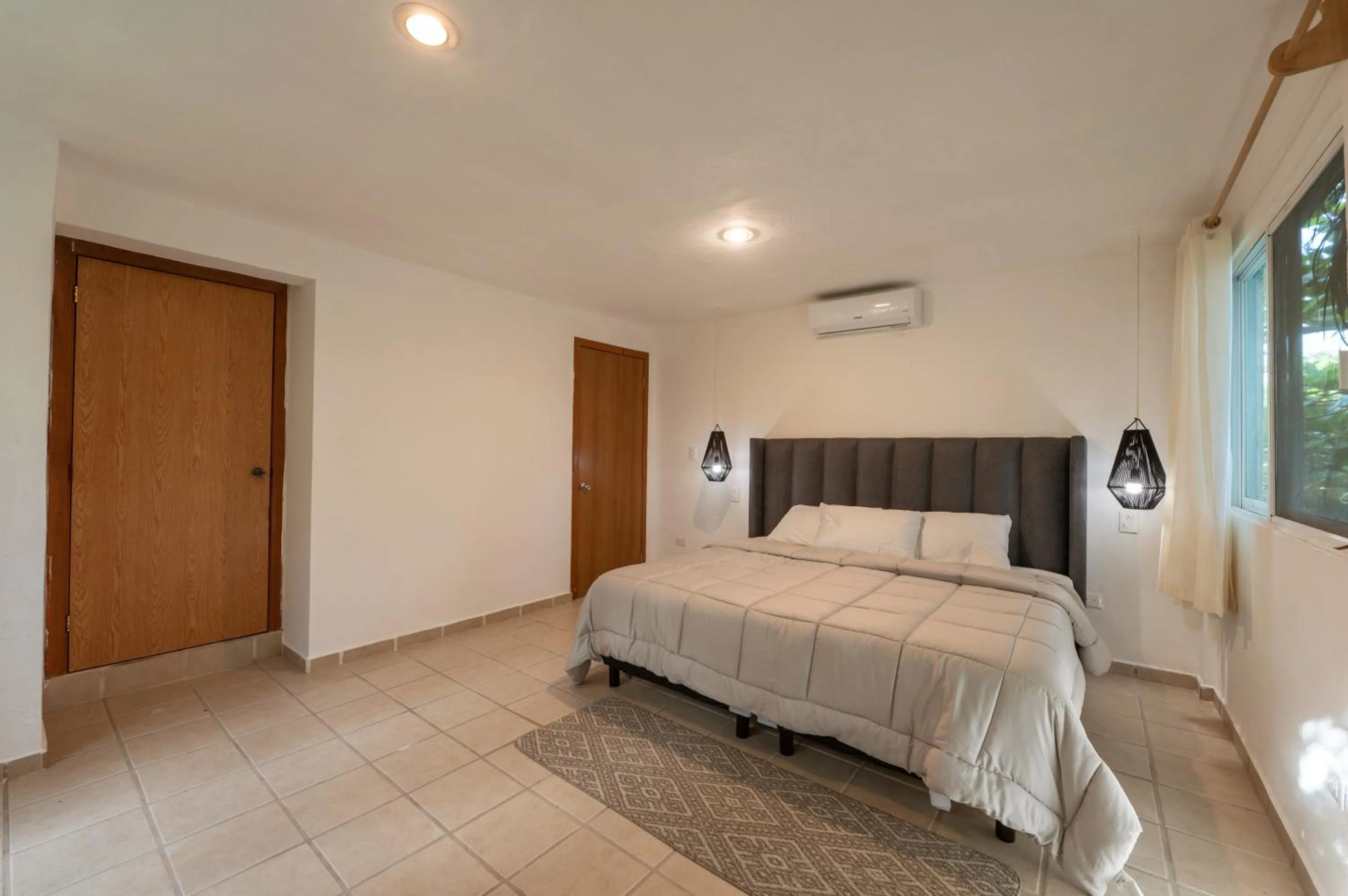 Photo of the whole room, Bed in Hotel Caracol Puerto Morelos