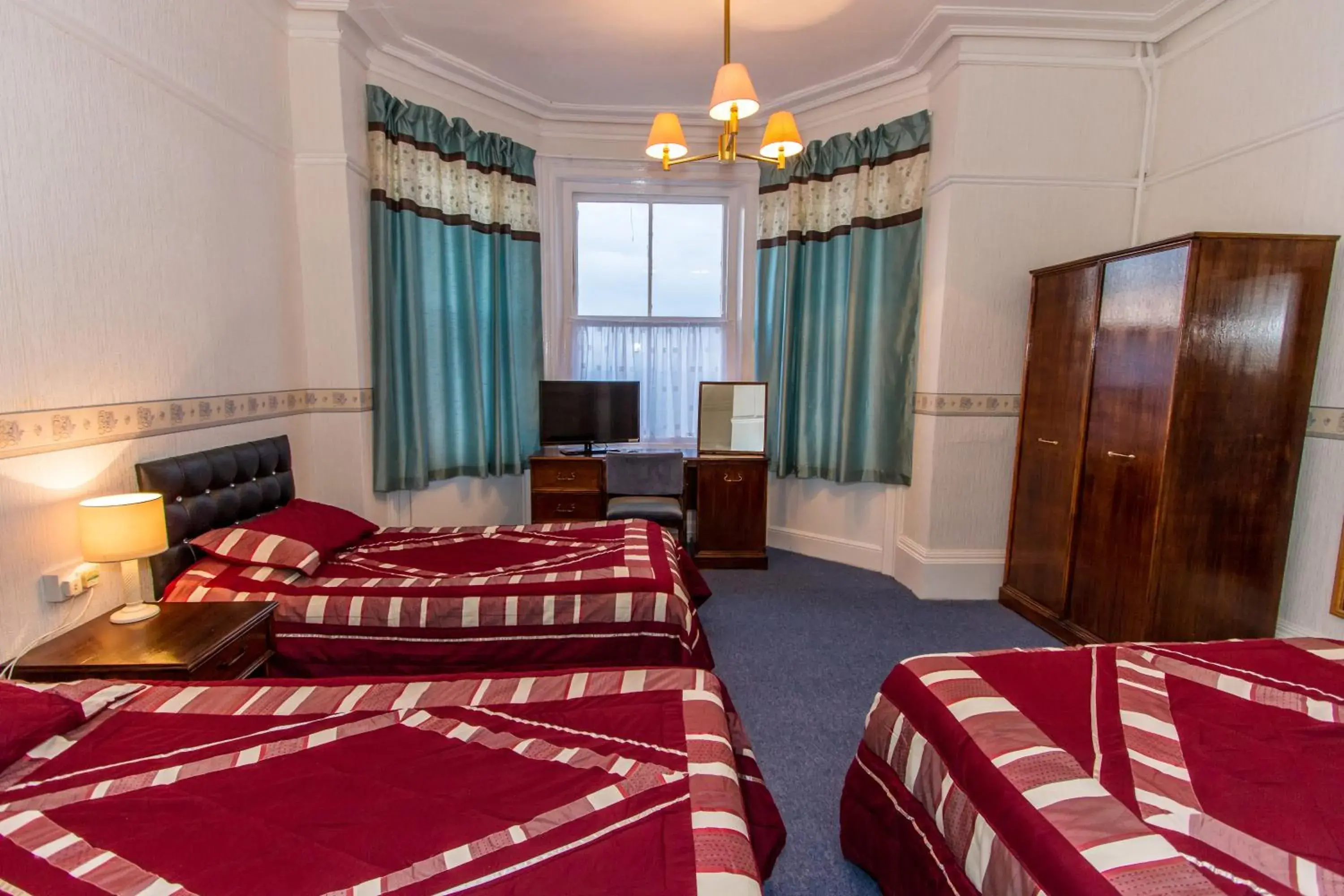 Family Room (2 Adults + 1 Child) in The Carlton Hotel Family Room (2 Adults + 1 Child) in The Carlton Hotel