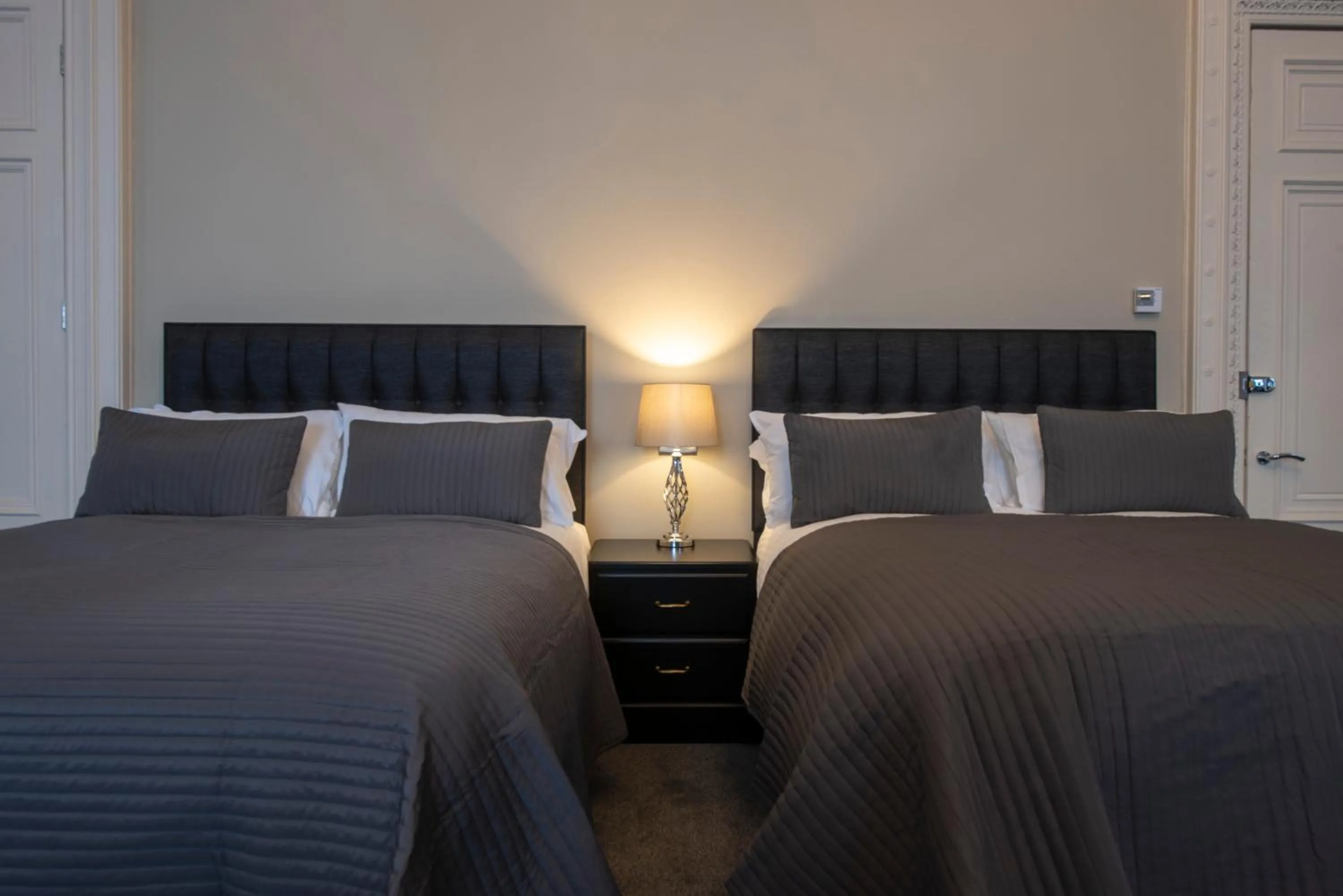 Bed in Grosvenor Suites