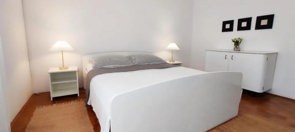 Bed in Amazing seaview apartment with a balcony near the beach - Kneza Trpimira I