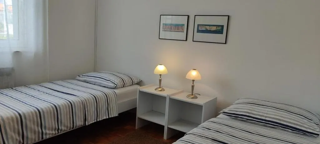 Bed in Amazing seaview apartment with a balcony near the beach - Kneza Trpimira I
