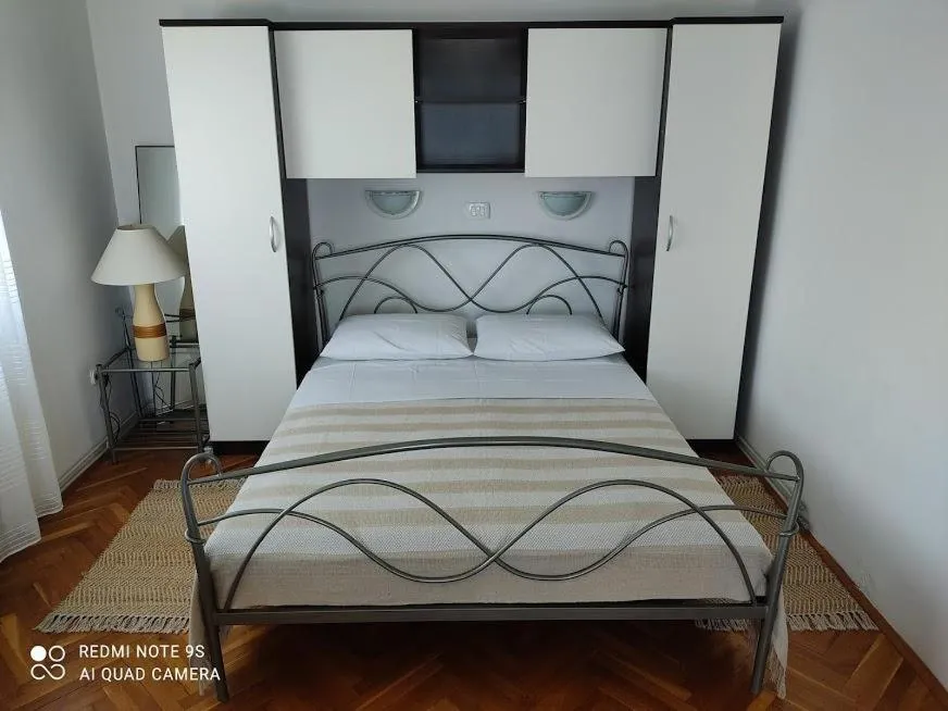 Bed in Amazing seaview apartment with a balcony near the beach - Kneza Trpimira I
