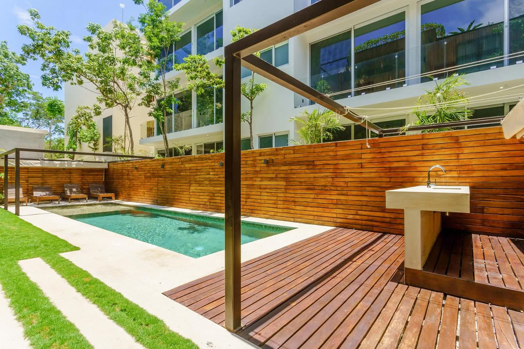 Swimming pool in Chic Suites in the Heart of Tulum by Stella Rentals