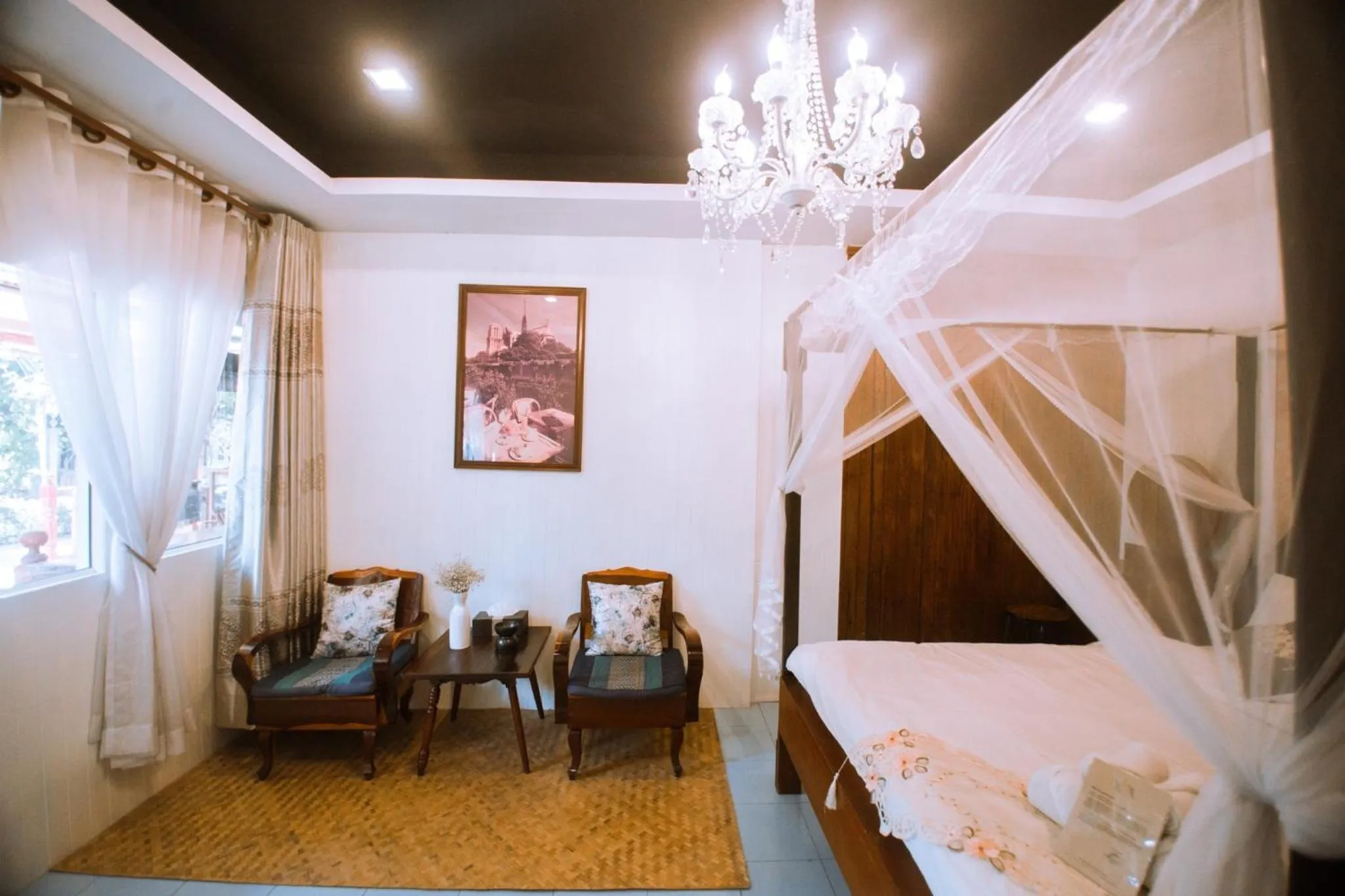 Seating area, Bed in The Antique Riverside Resort