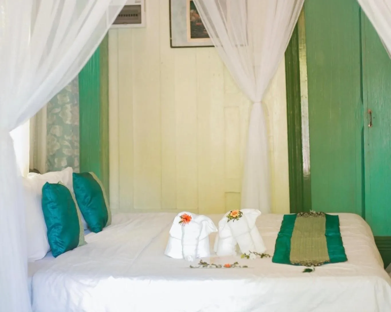 Bed in The Antique Riverside Resort