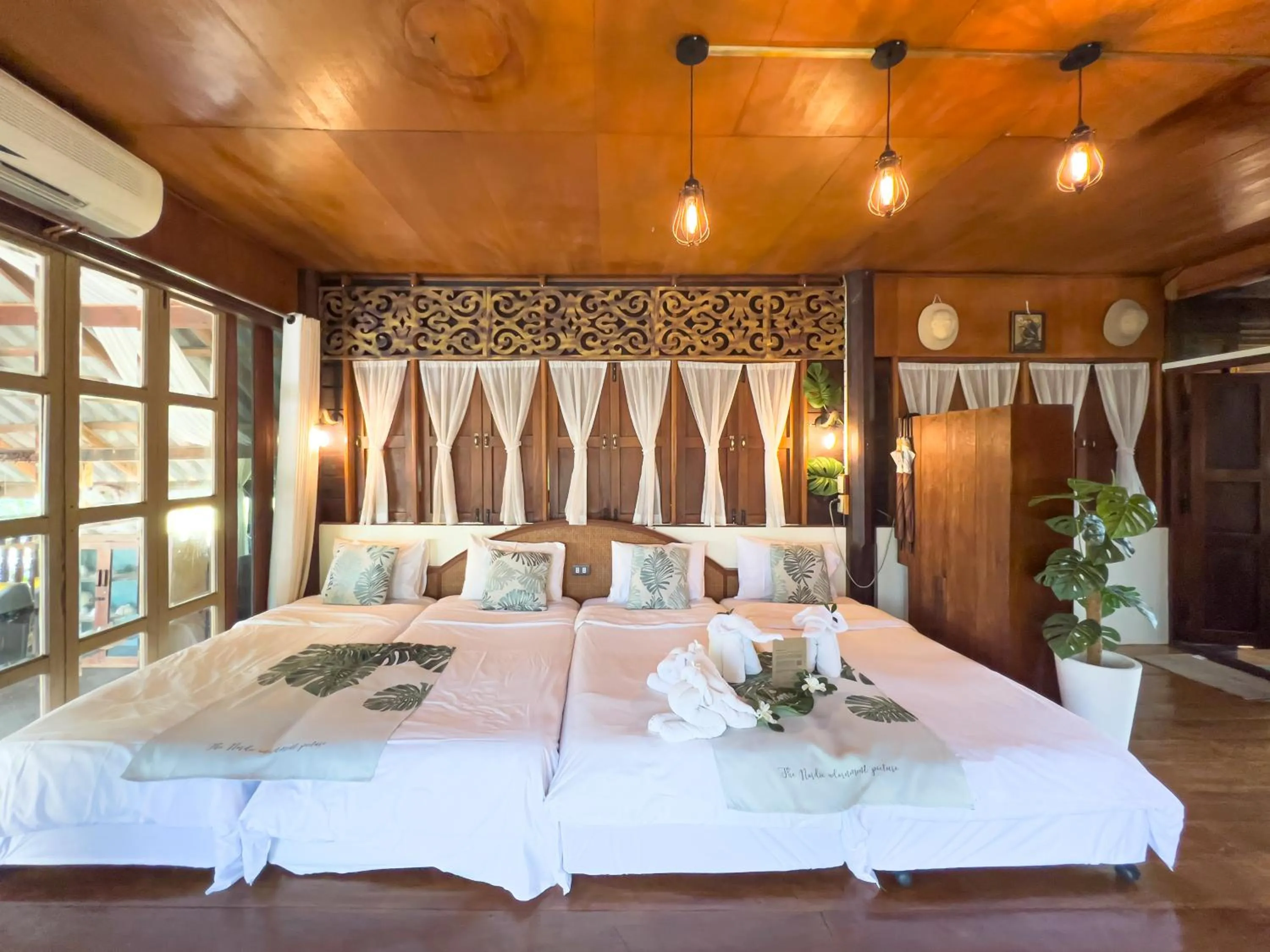 Bed in The Antique Riverside Resort