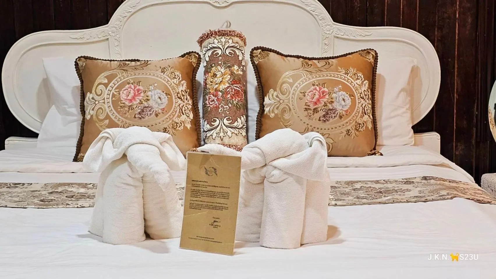 Bed in The Antique Riverside Resort