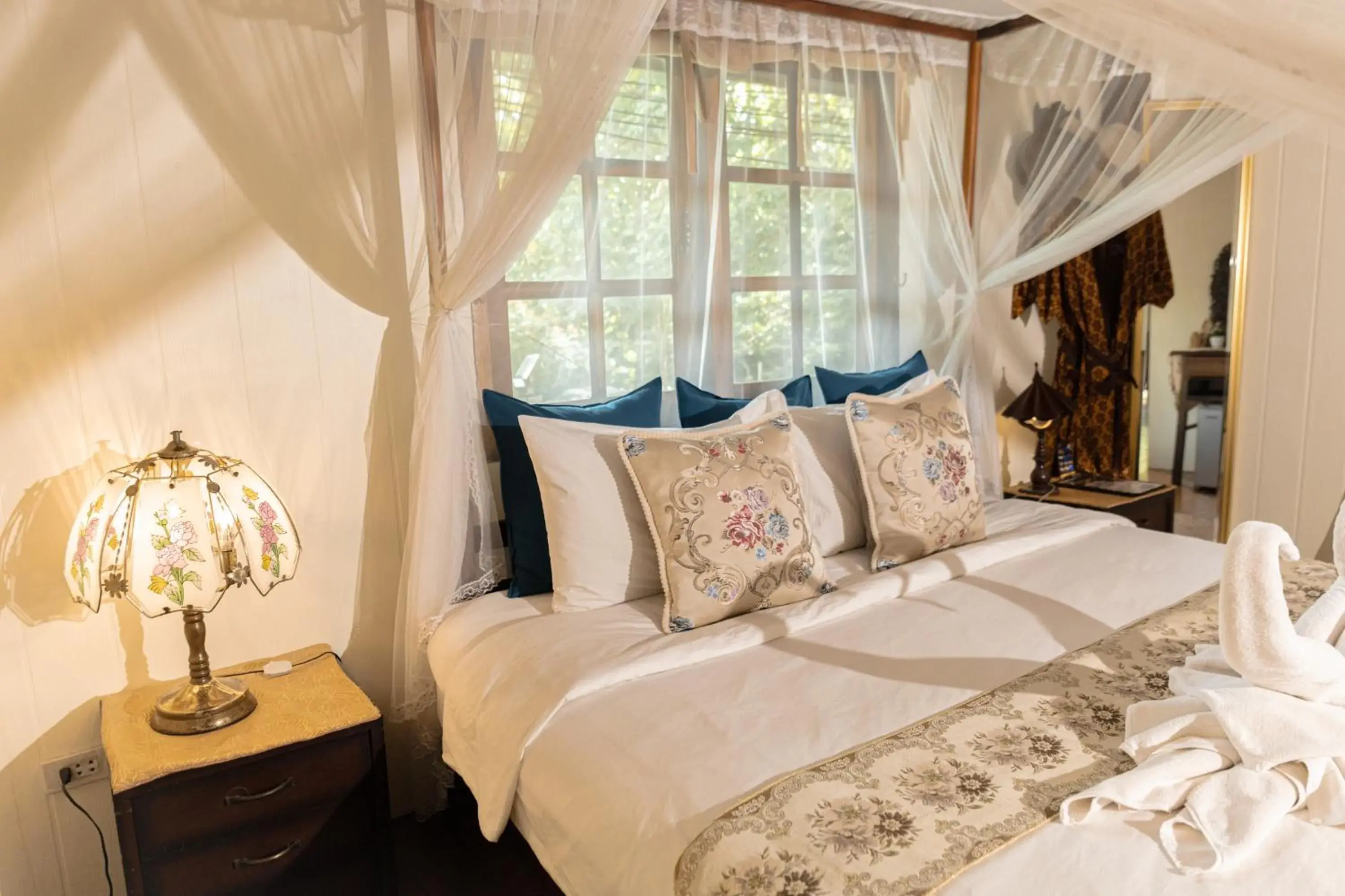 Bed in The Antique Riverside Resort Bed in The Antique Riverside Resort