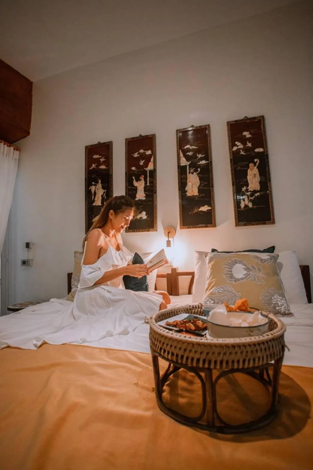 Bed in The Antique Riverside Resort