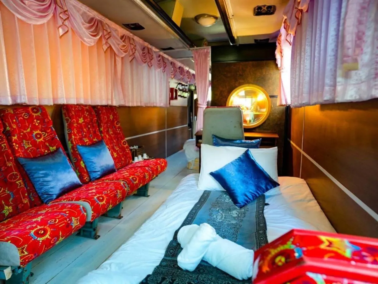 Seating area, Bed in The Antique Riverside Resort