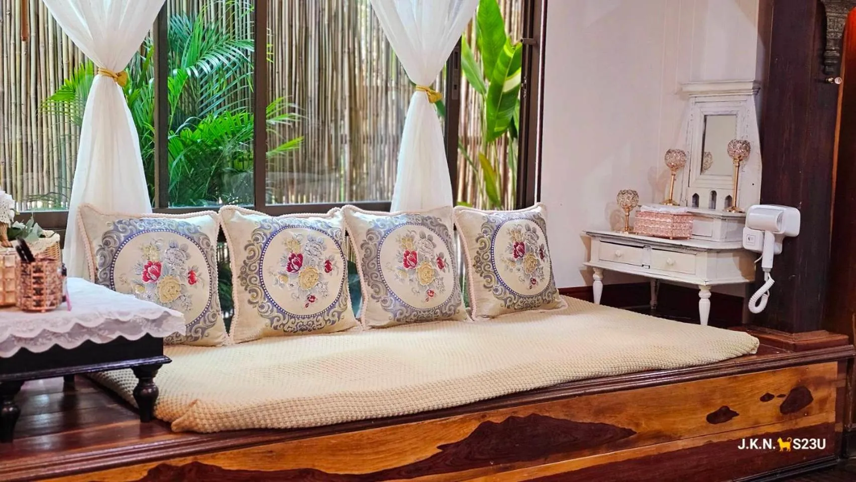 Seating area, Bed in The Antique Riverside Resort