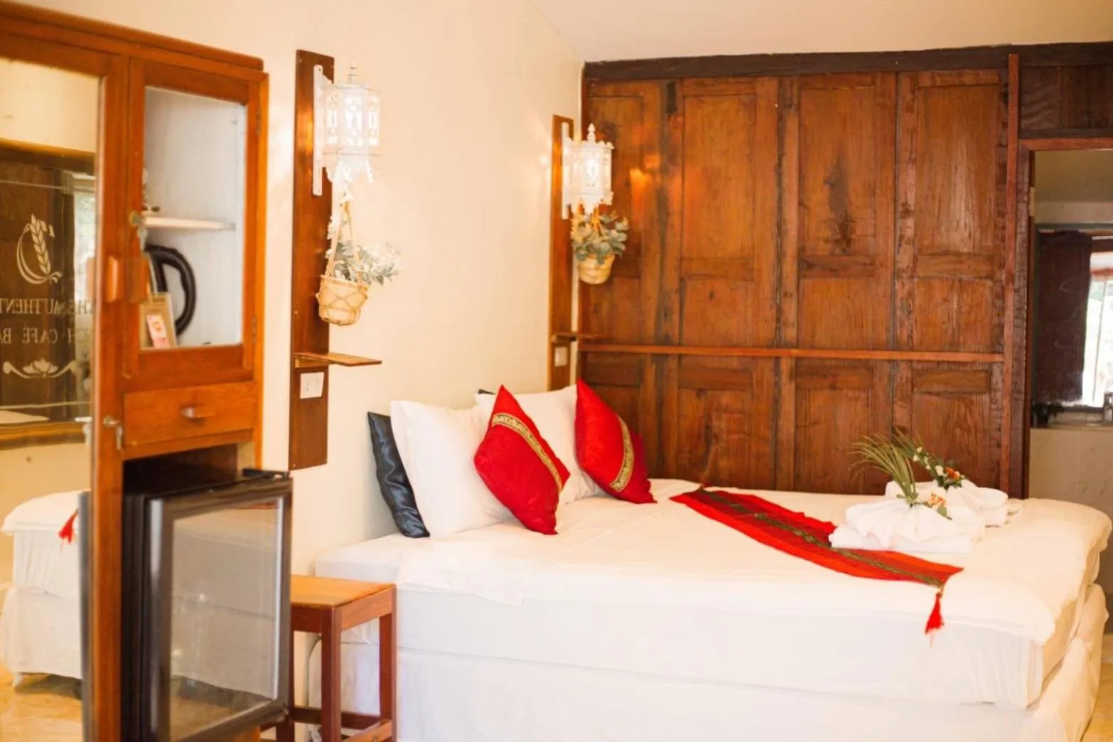 Bed in The Antique Riverside Resort