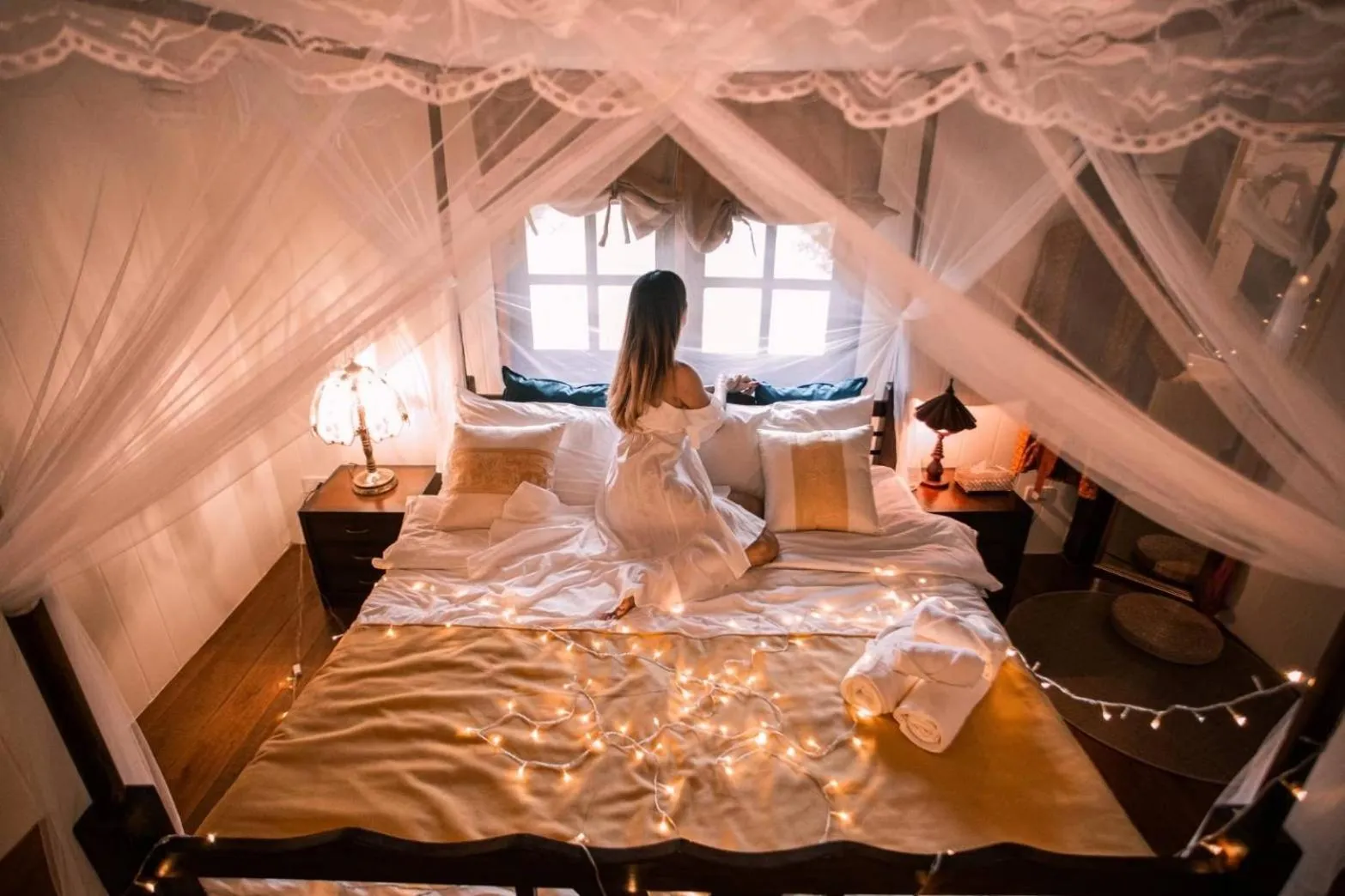 Bed in The Antique Riverside Resort