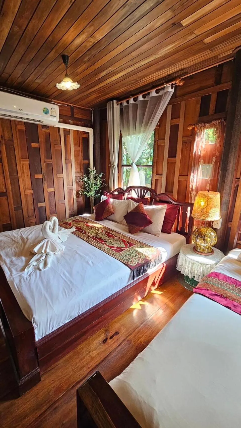 Bed in The Antique Riverside Resort