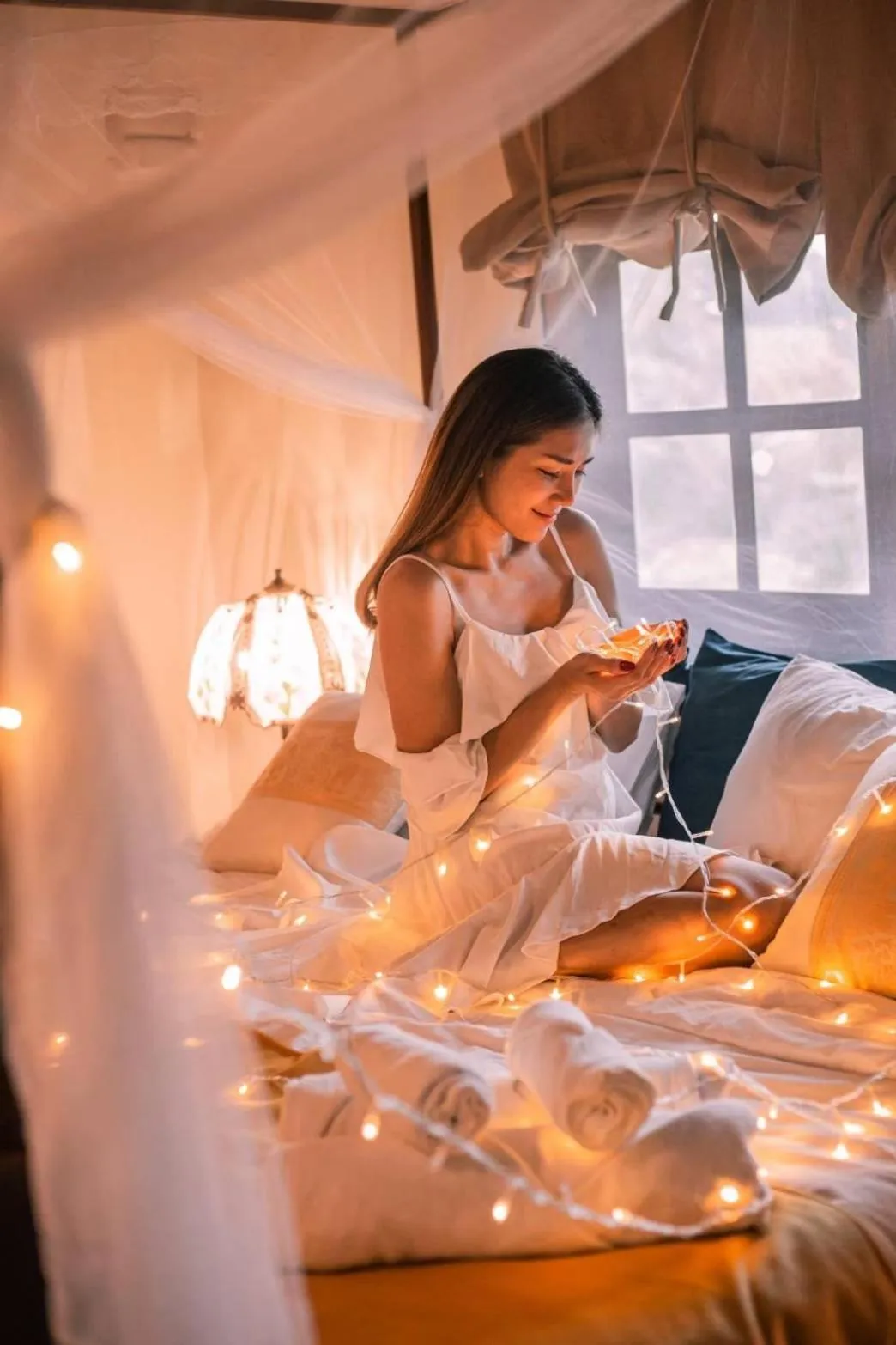 Bed in The Antique Riverside Resort