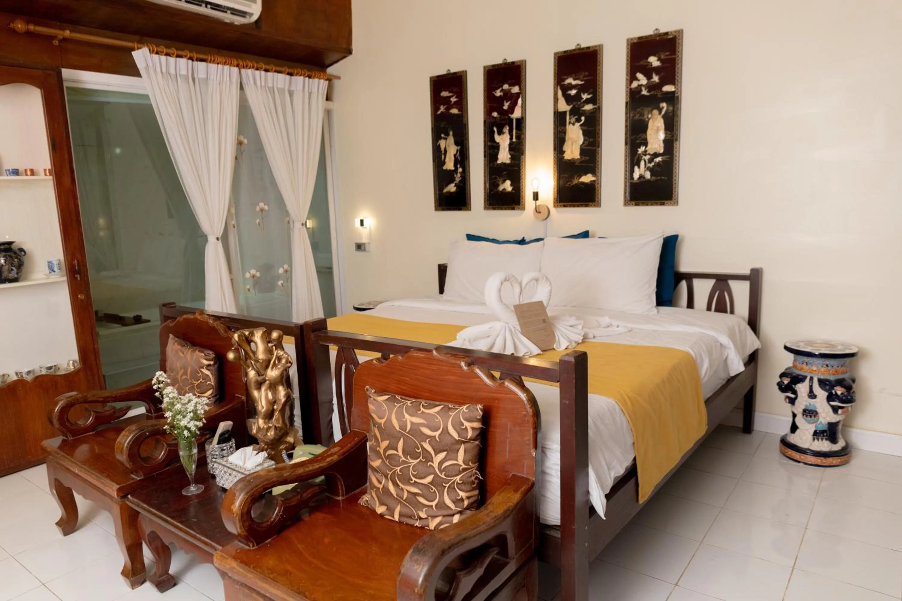 Bed in The Antique Riverside Resort