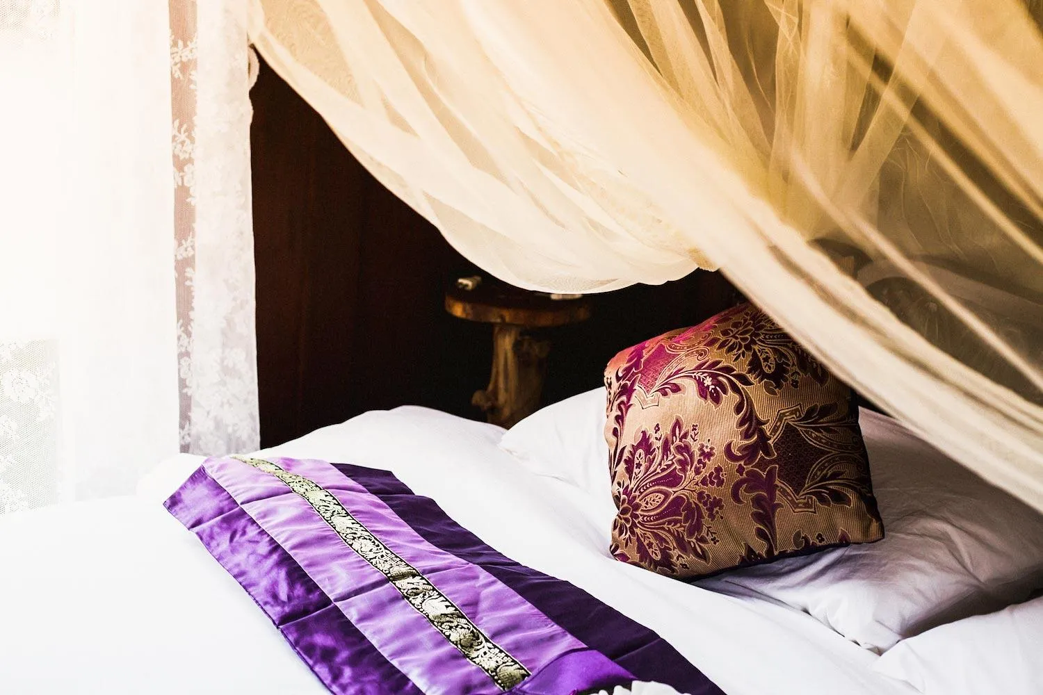 Bed in The Antique Riverside Resort