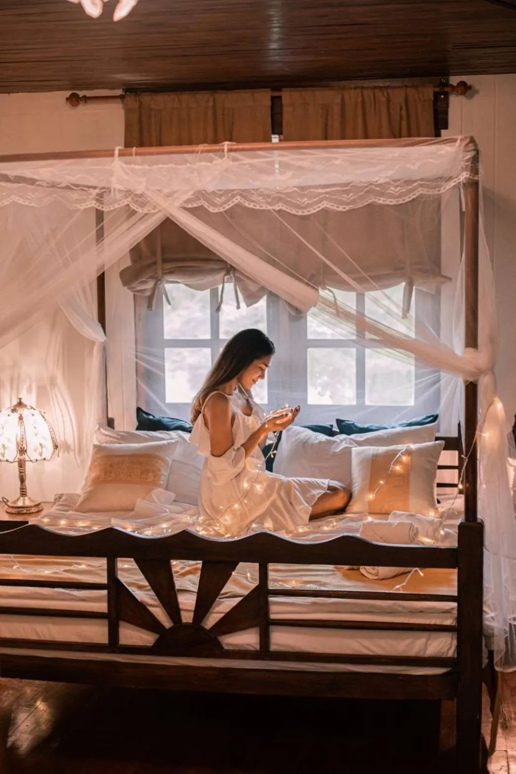 Bed in The Antique Riverside Resort