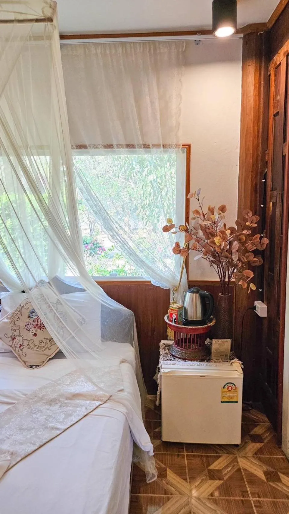 Bed in The Antique Riverside Resort