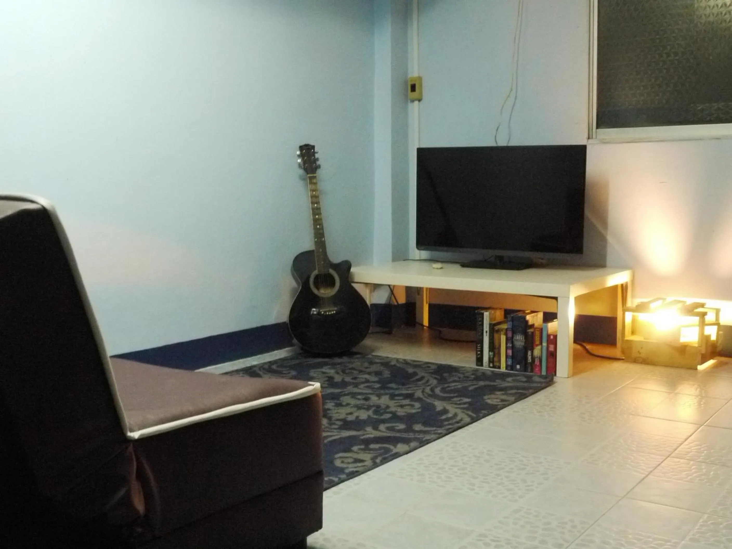 Communal lounge/ TV room in Asleep Hostel