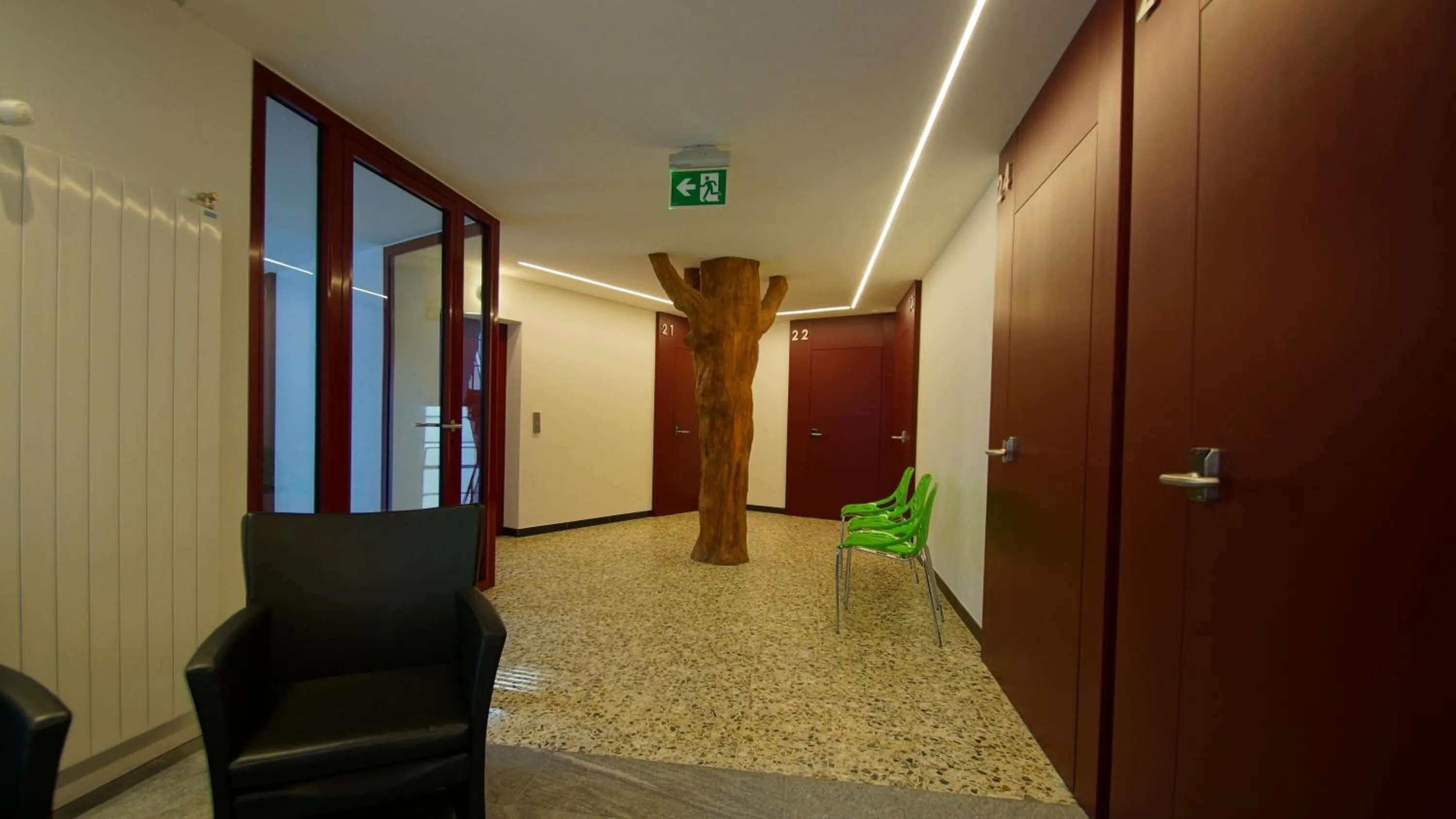 Communal lounge/ TV room in Albergo Porta Verzasca