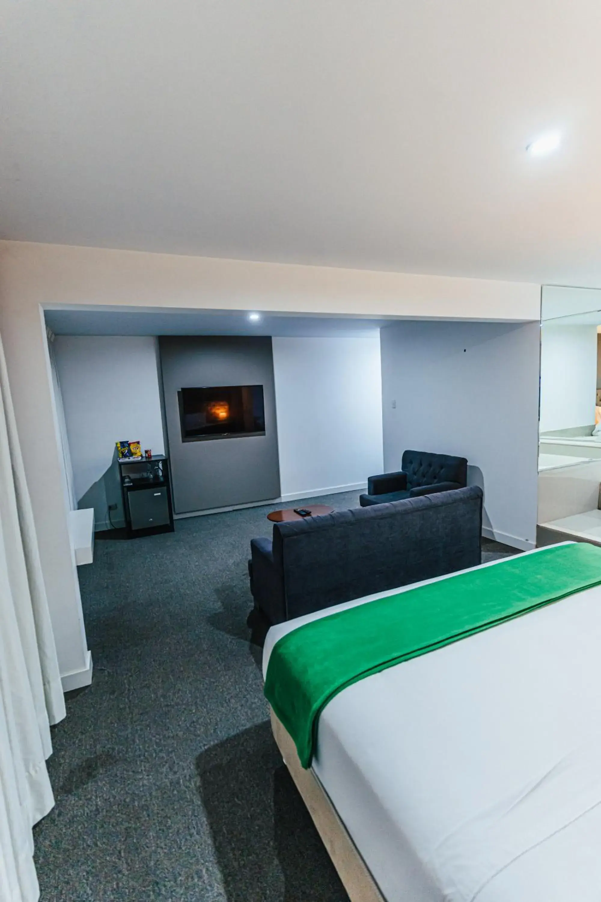 Communal lounge/ TV room, Bed in Hotel Hacienda Lima Norte Communal lounge/ TV room, Bed in Hotel Hacienda Lima Norte