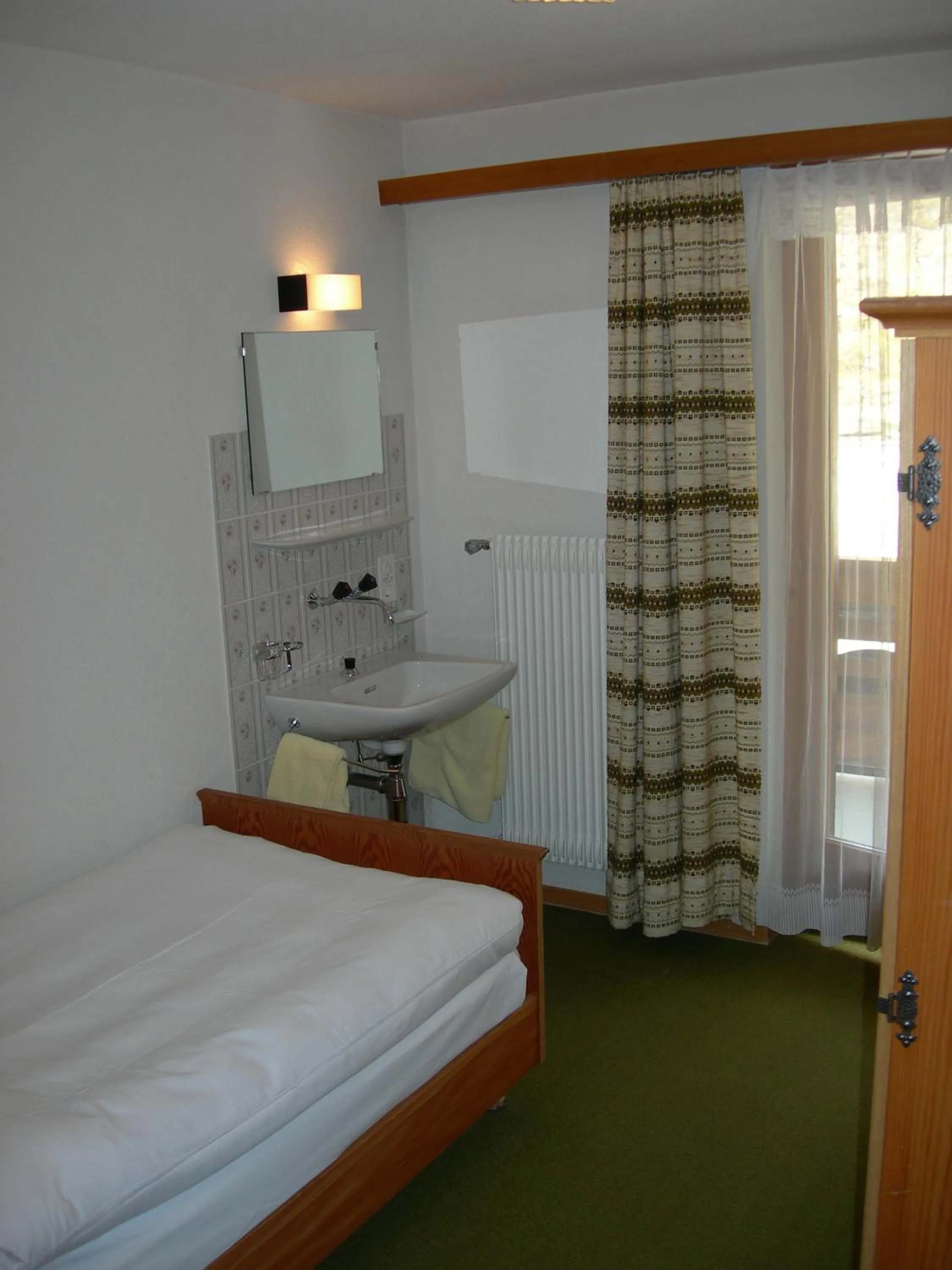 Bed in Hotel Adler