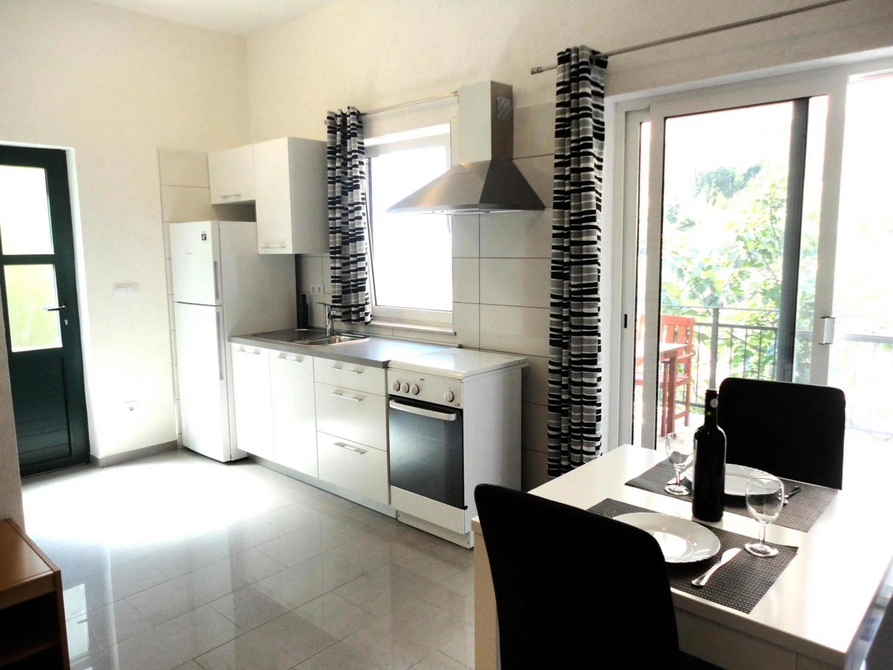 Kitchen or kitchenette in Paradise Apartments - Robinson getaway