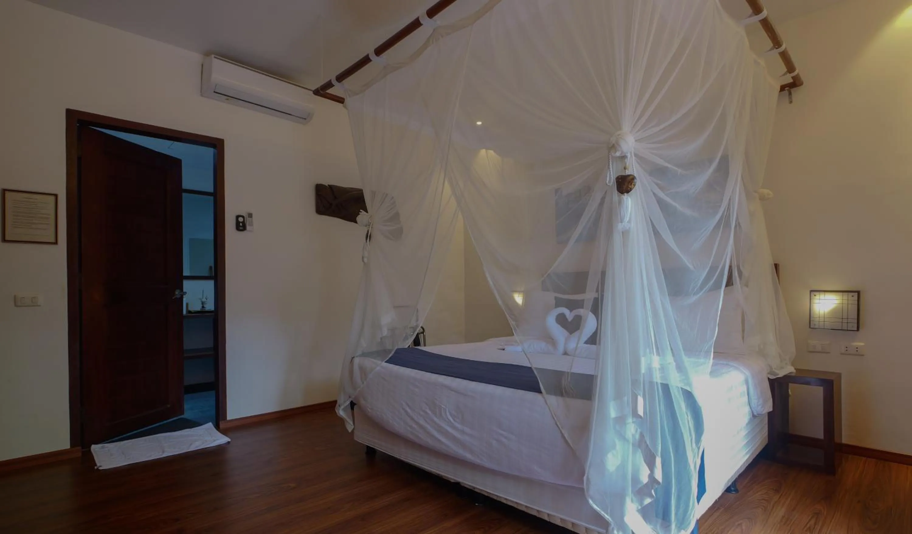 Bedroom, Bed in Last Frontier Beach Resort - Adults Only