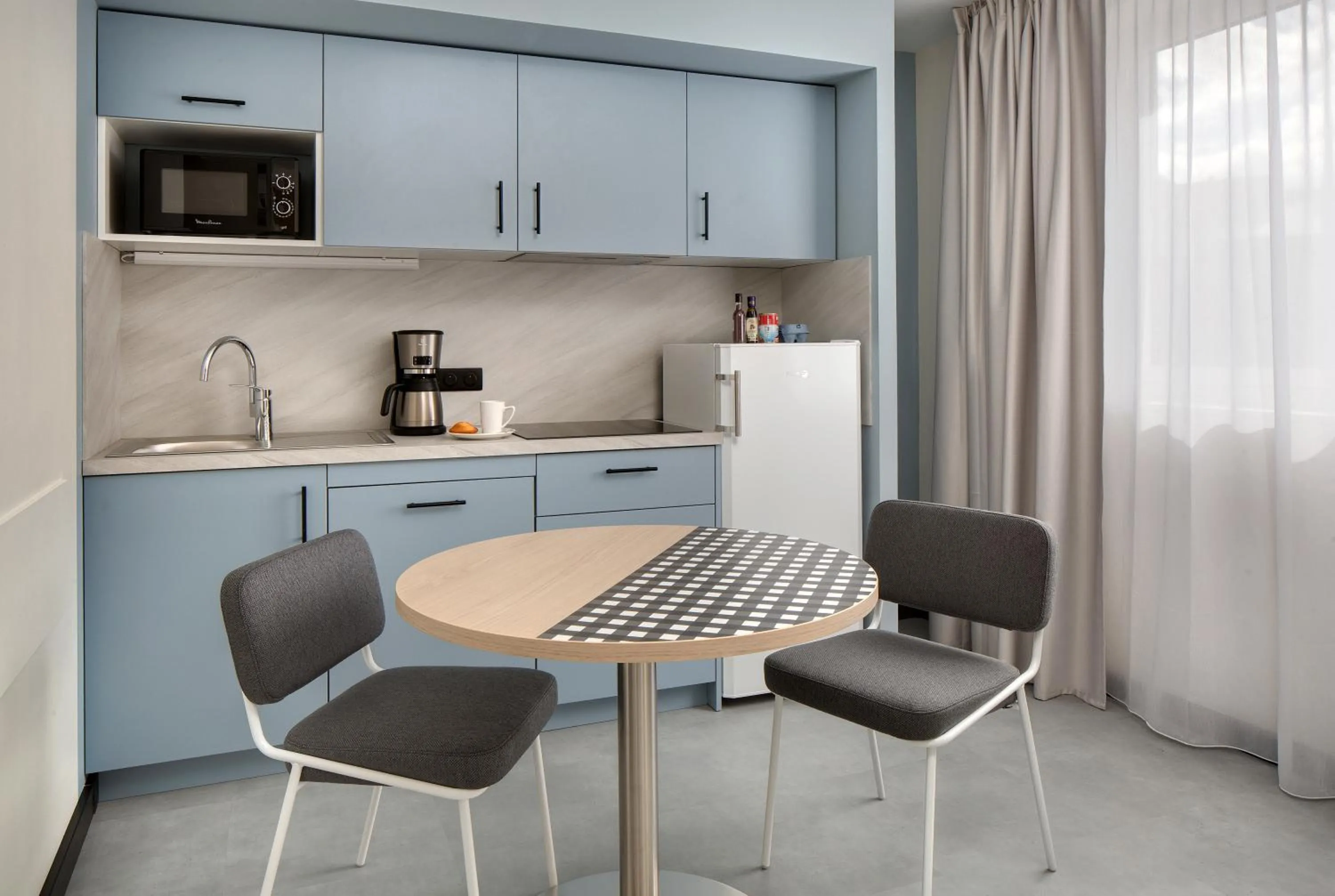 Kitchen or kitchenette in Résidence Callou by Vy Resort Thermal & Spa