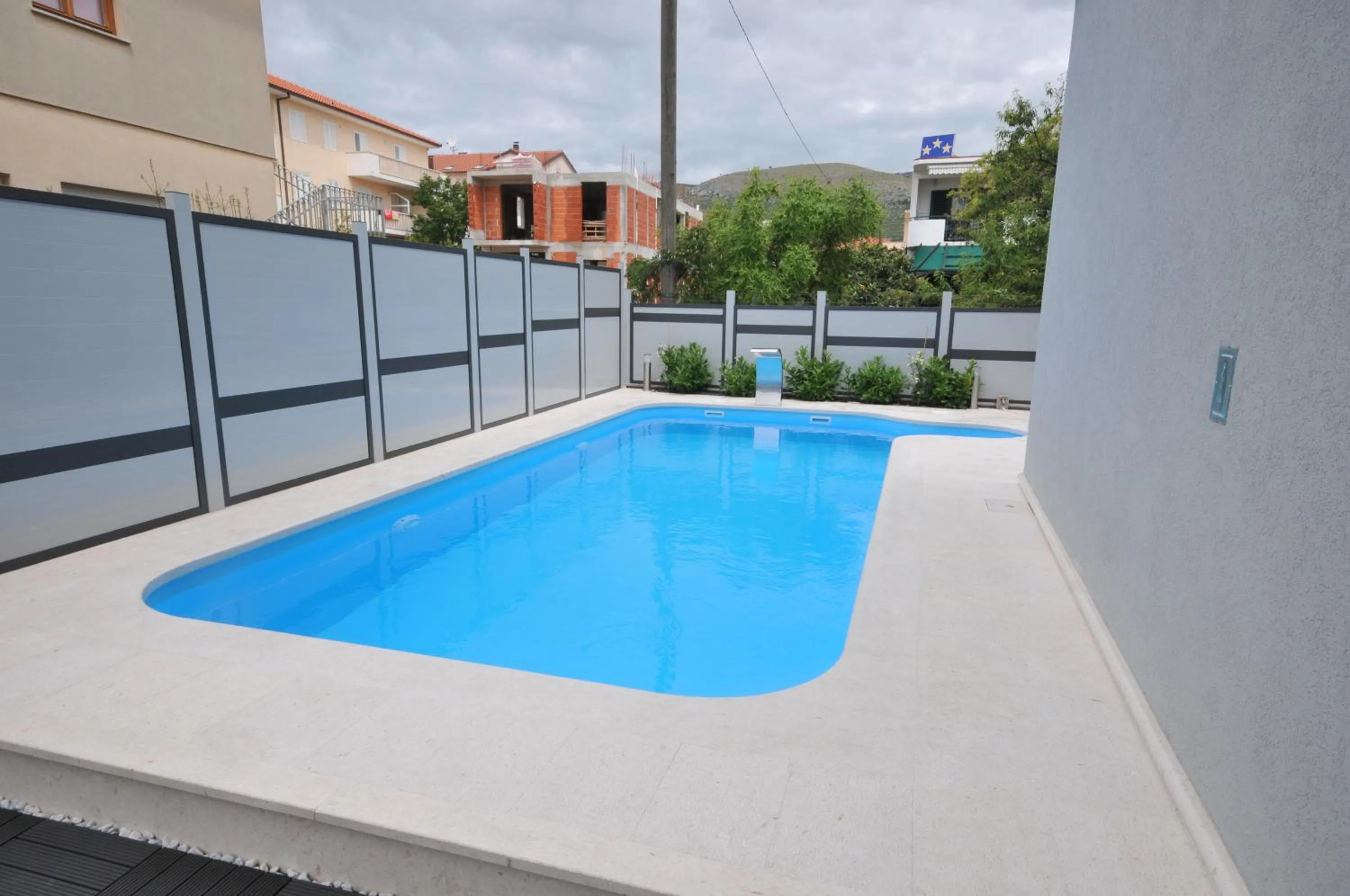 Swimming pool in Apartments & Rooms Villa Maslina