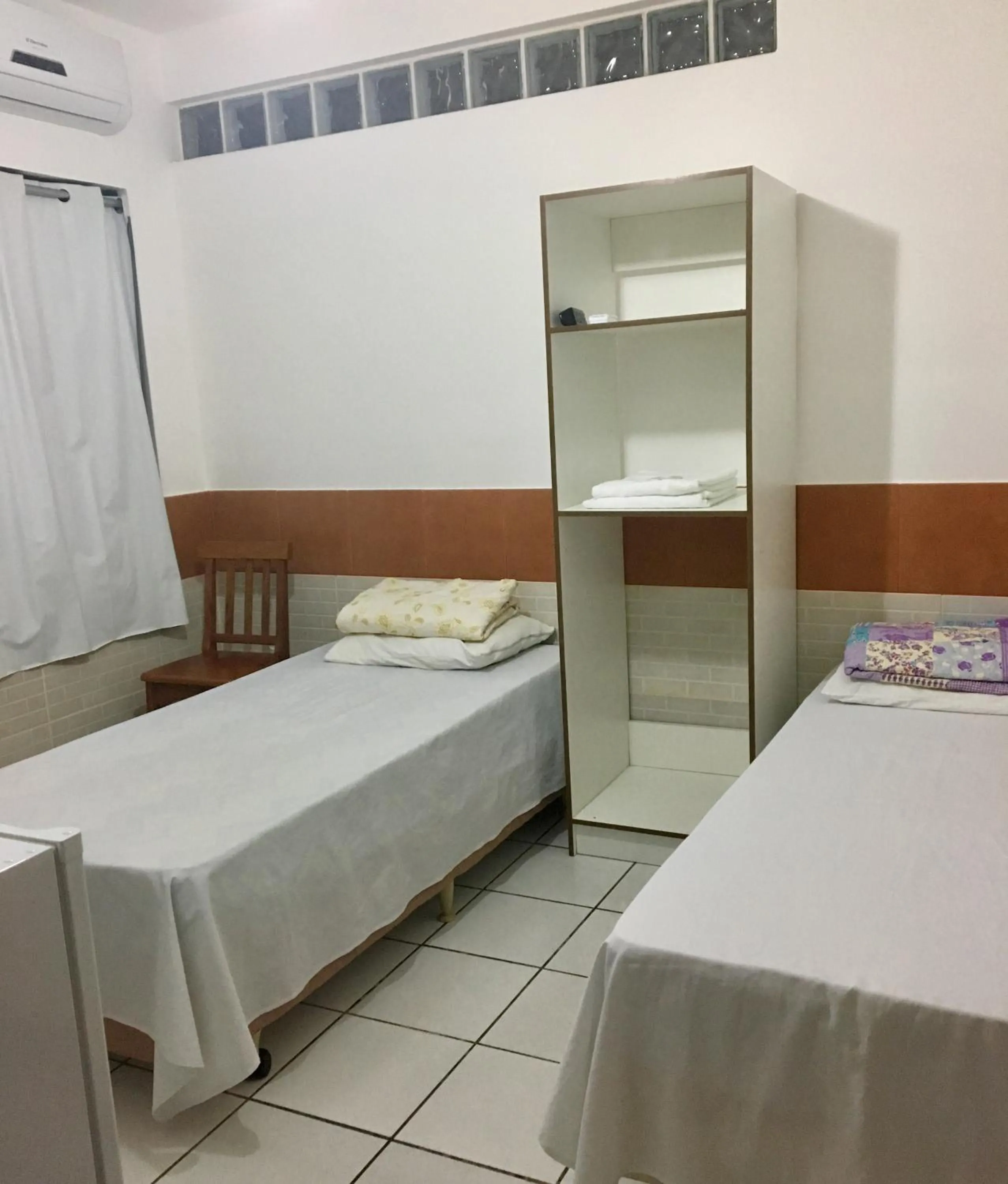 Bed in Pousada Bem Brasil