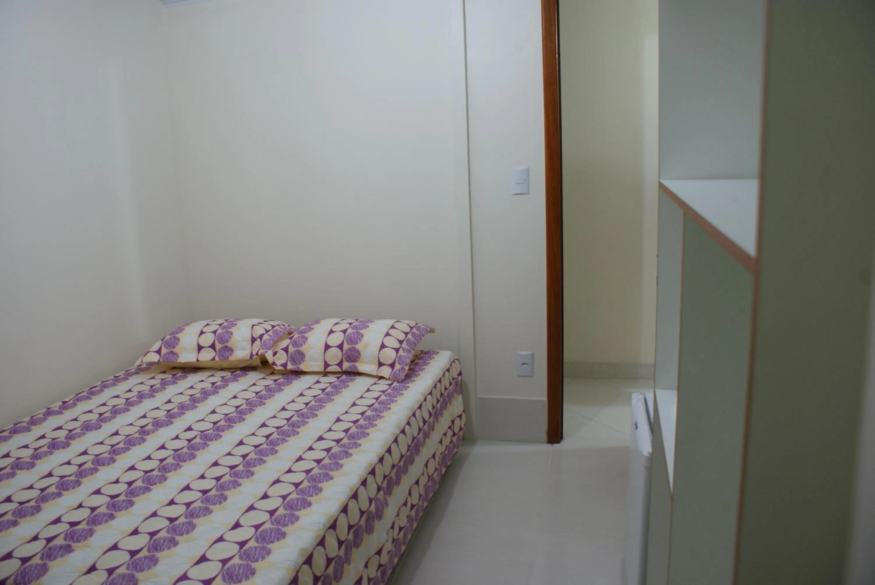 Bed in Pousada Bem Brasil
