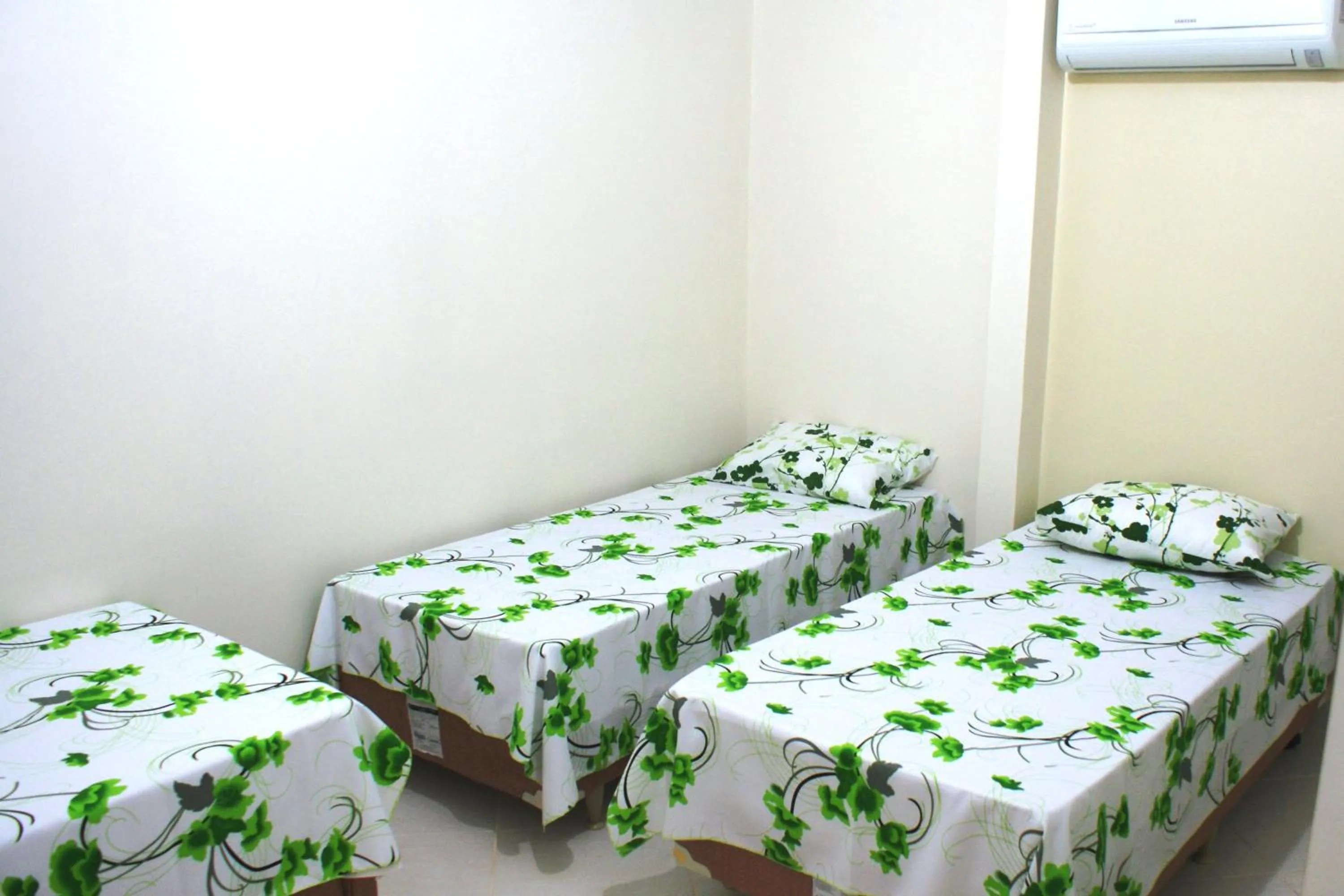 Bed in Pousada Bem Brasil
