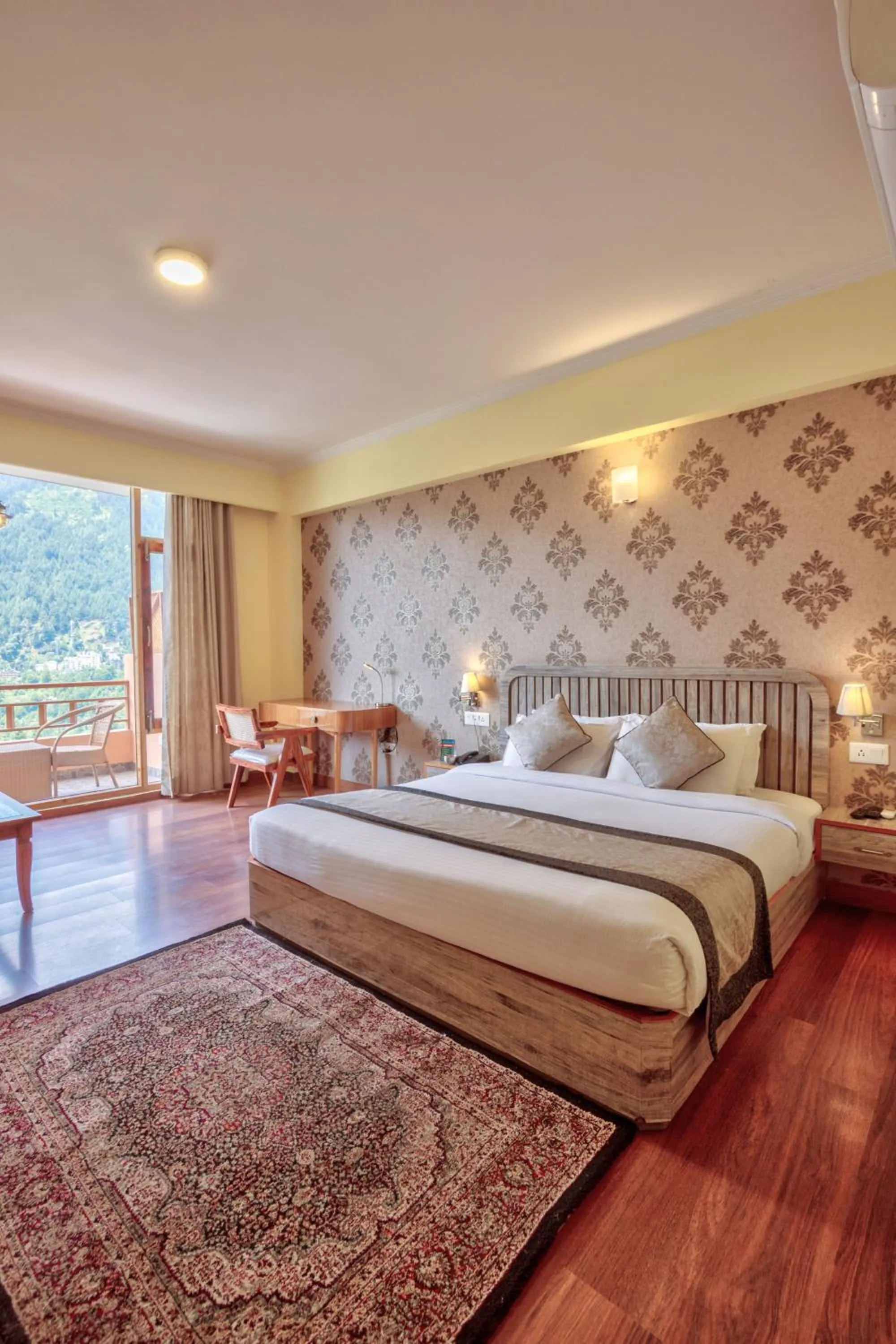 Bed in Snow Flakes Resort And Spa Centrally Heated Luxury Resort