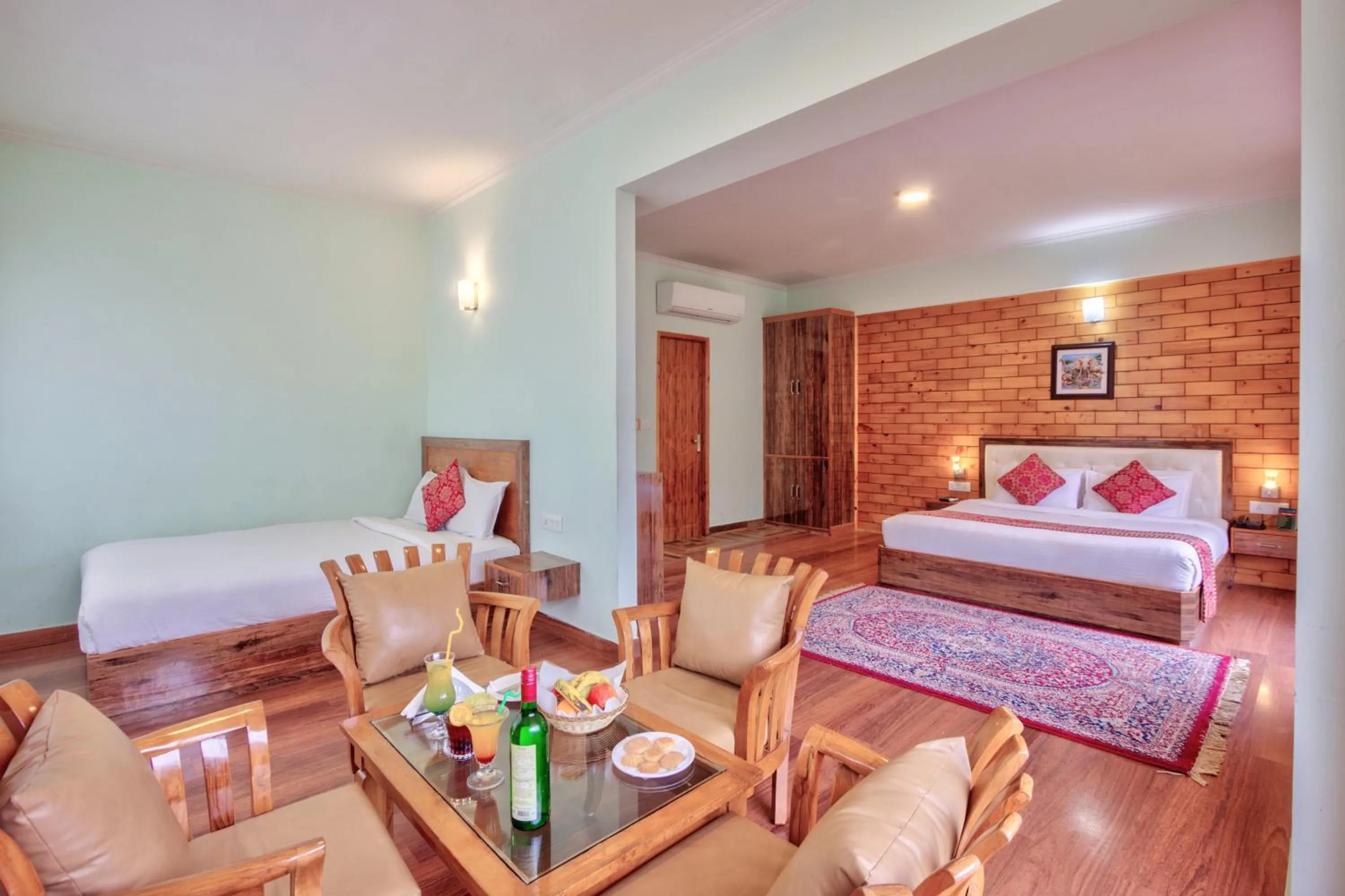 Seating area, Bed in Snow Flakes Resort And Spa Centrally Heated Luxury Resort